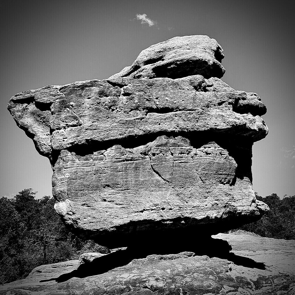 Balanced Rock. Large boulder. Clear sky. Black and White.