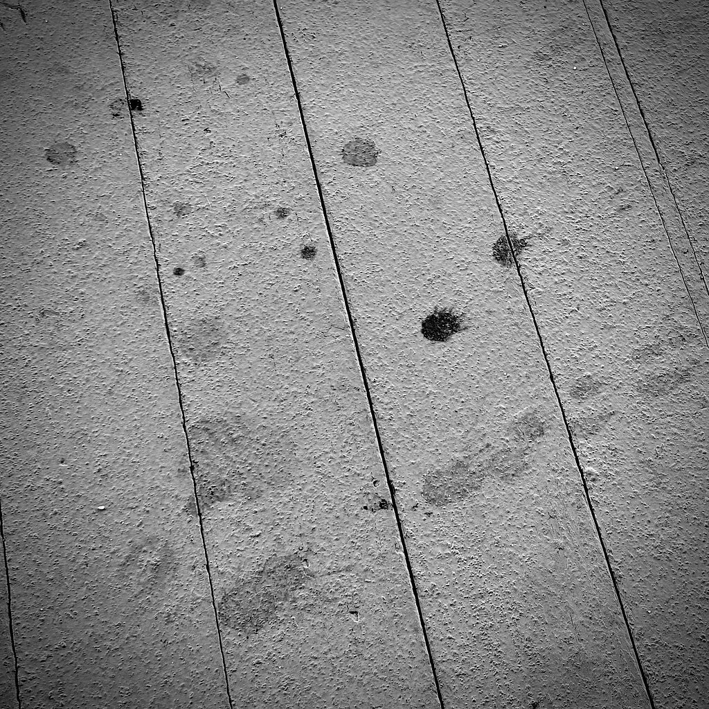 Concrete ground with creases and stains. Black and White
