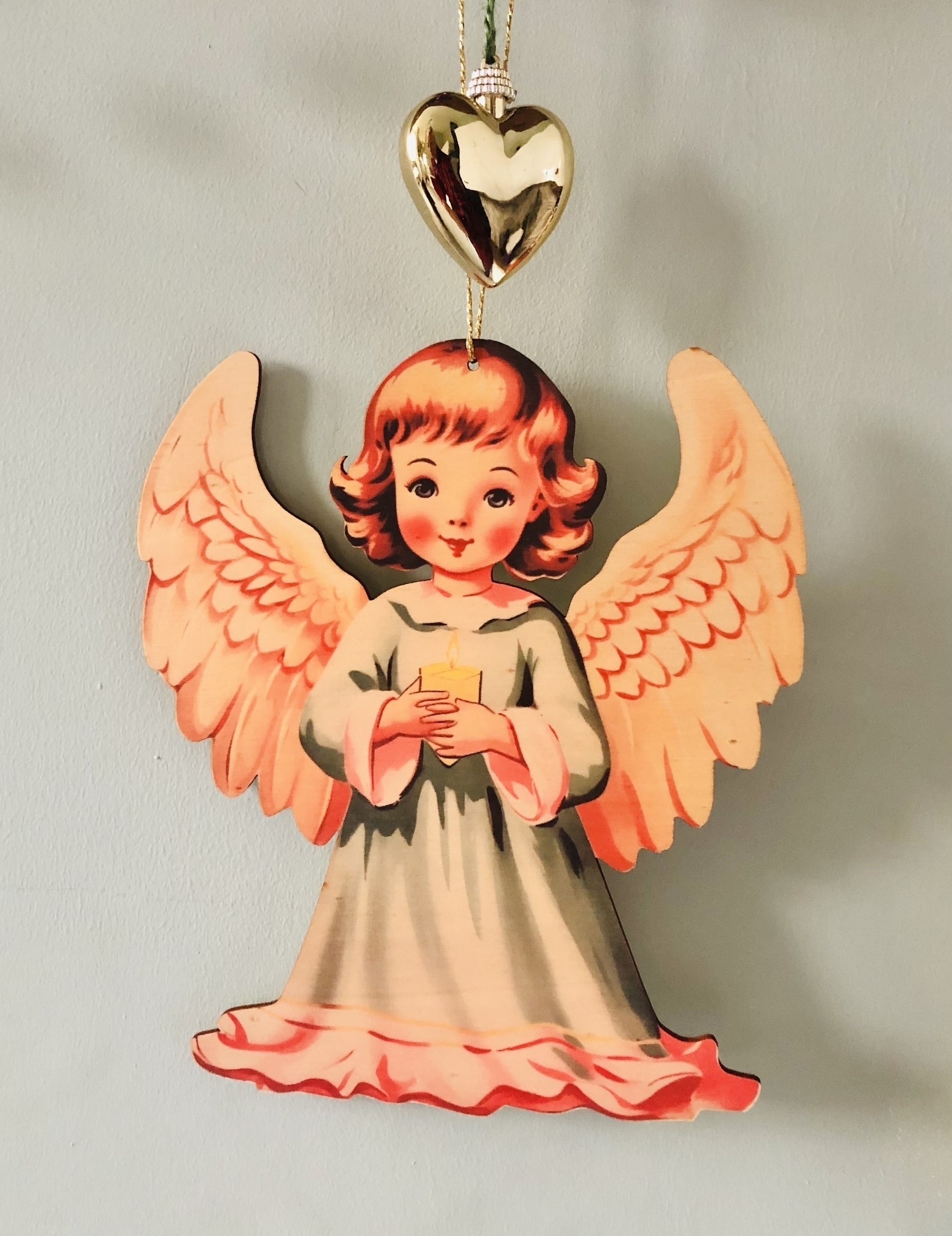 Sweet decoration of an angel holding a candle