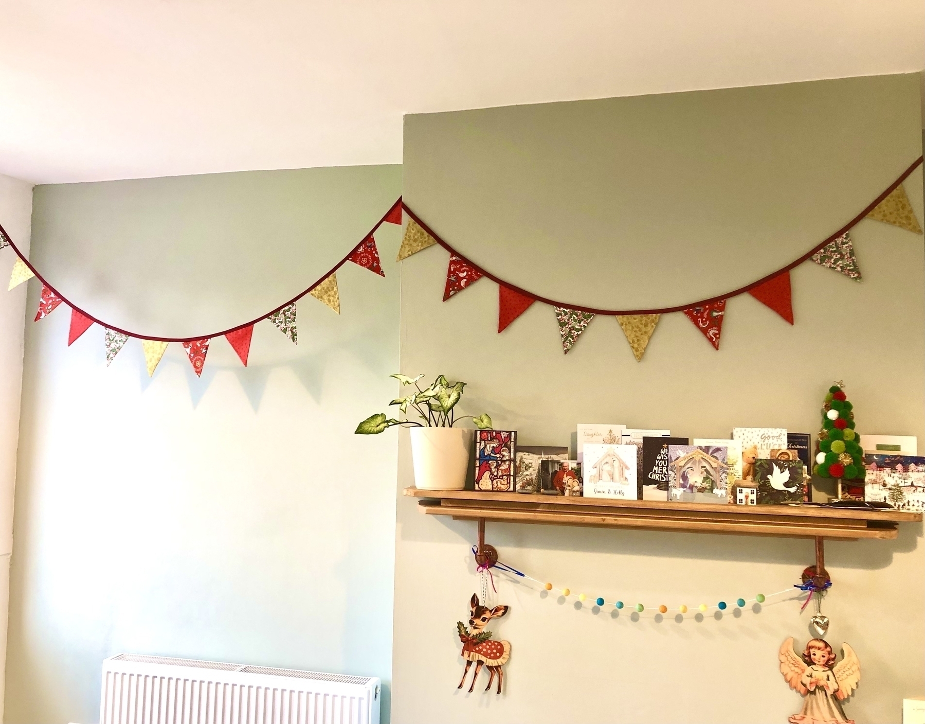 Christmas bunting and a shelf full of cards