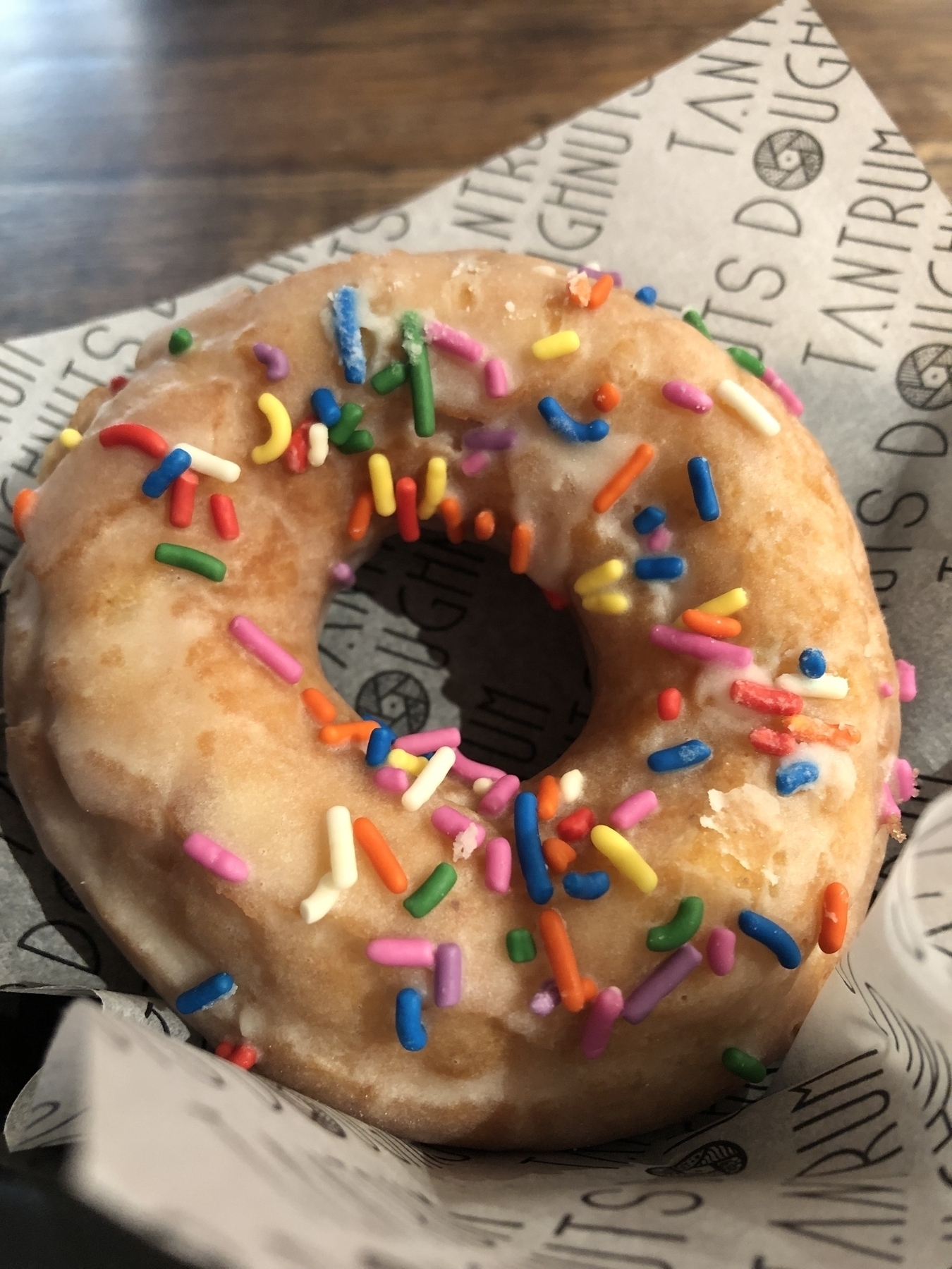 ring donut with hundred and thousands sprinkled on top