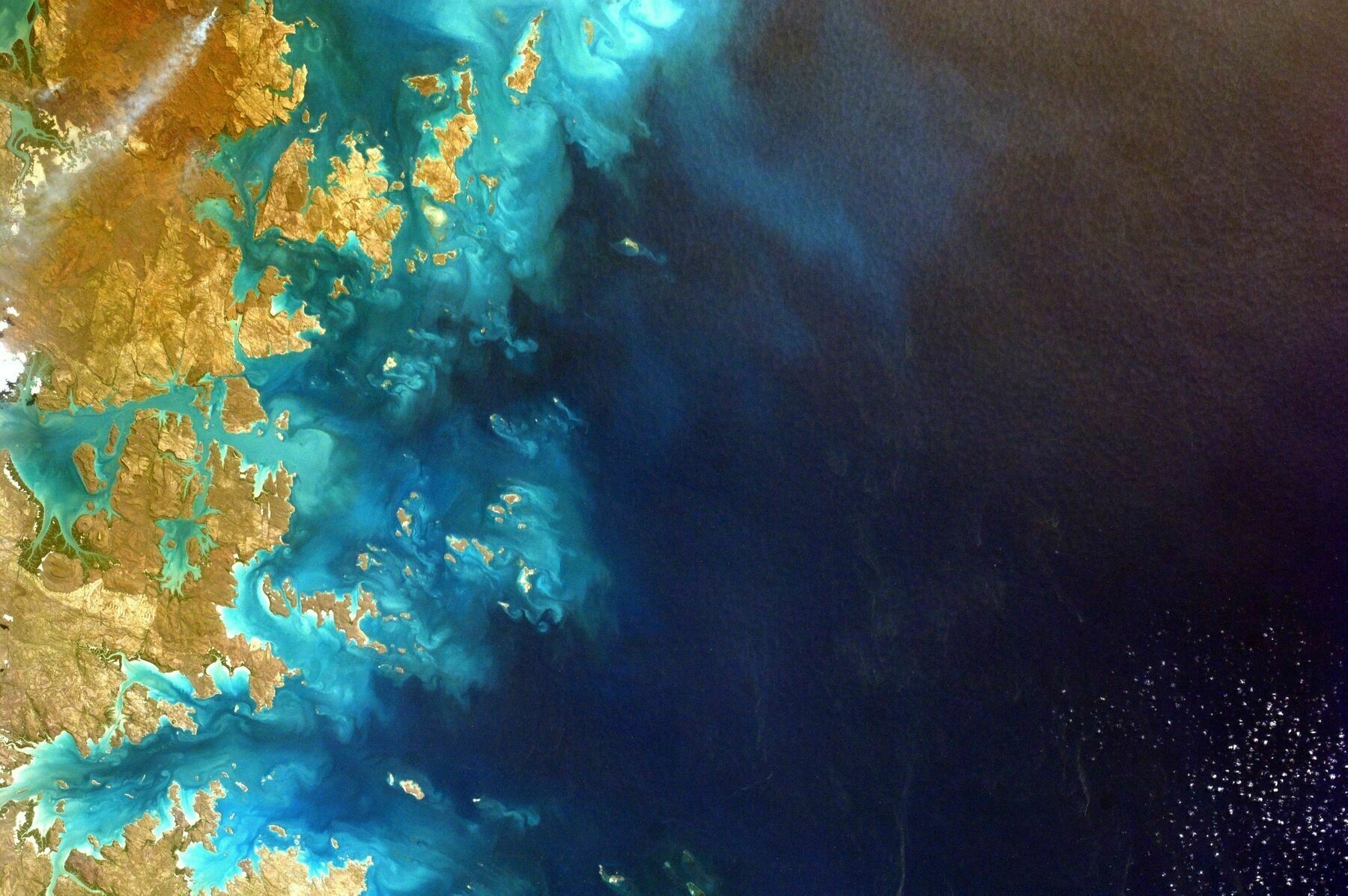 satellite image of deep blue sea and land