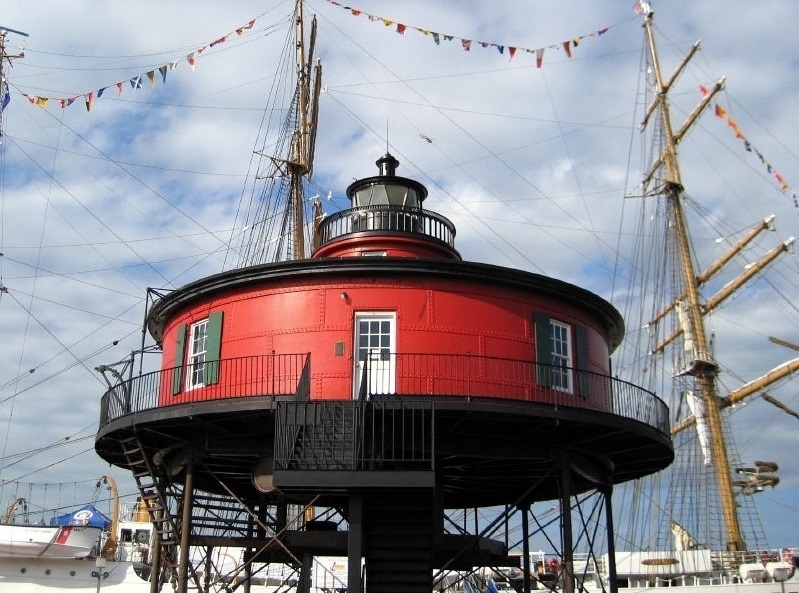 A round, red building, with the appearance of a squat lighthouse