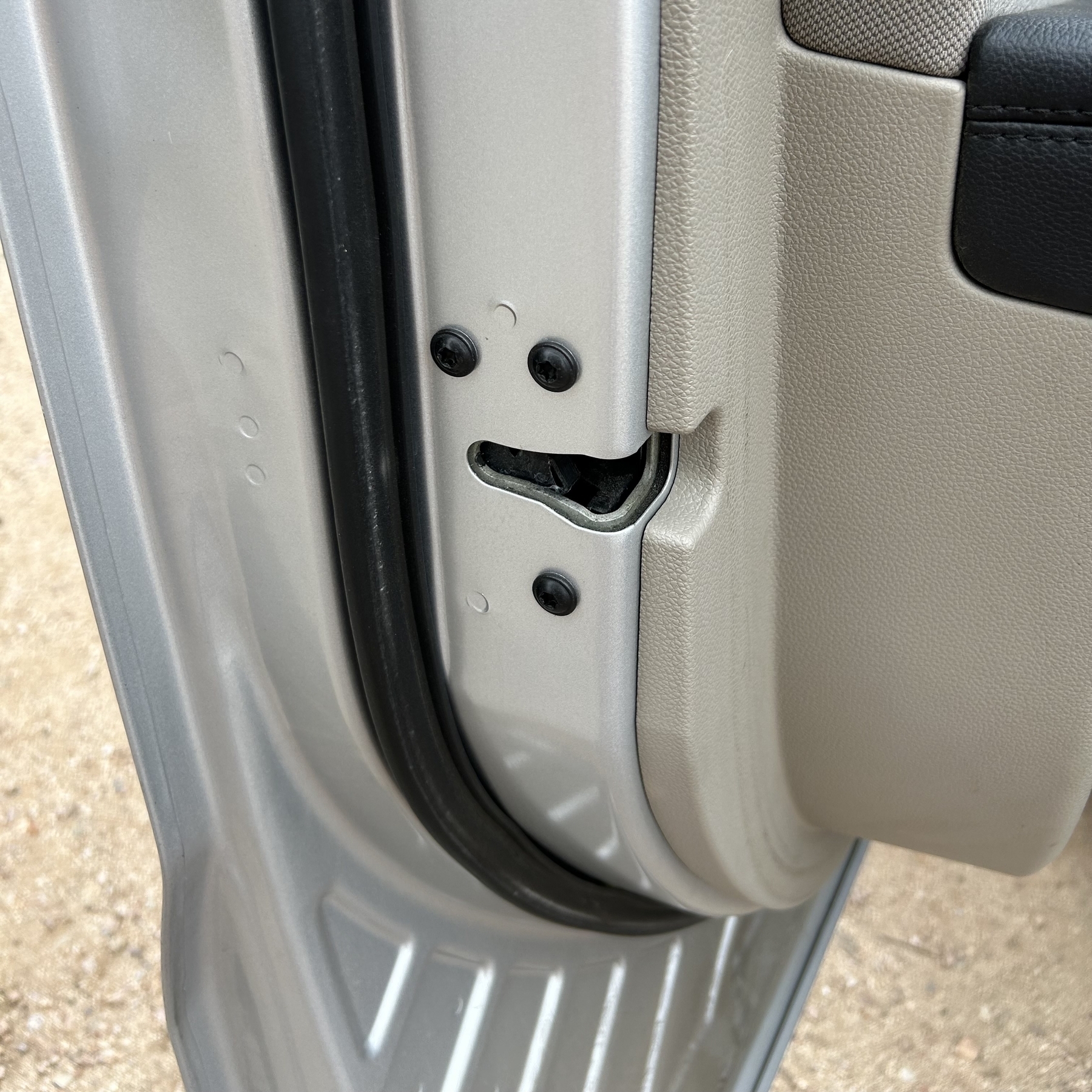 Something that looks like a face on the inside of a car door 