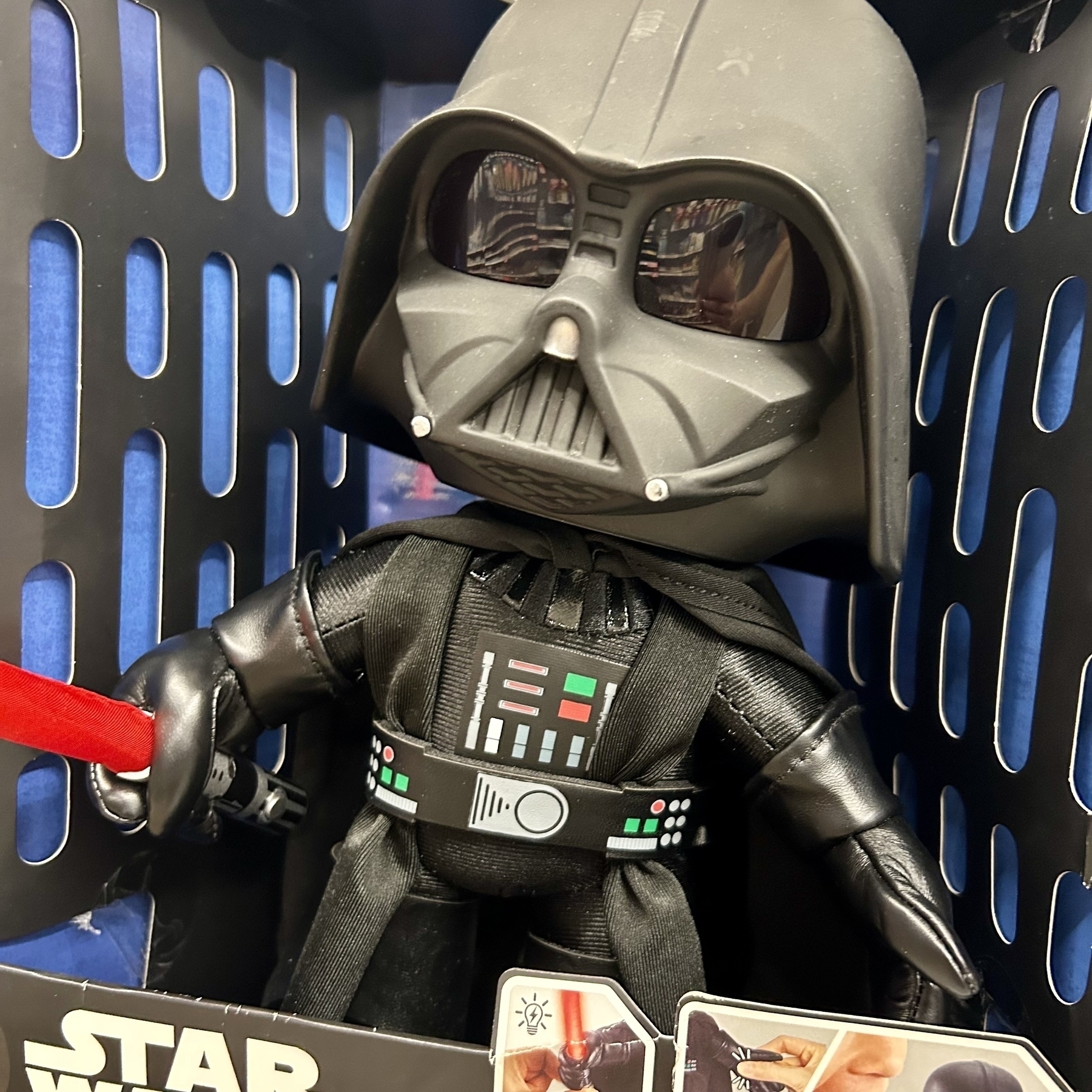 A small toy of Darth Vader but styled with an extra big head like a baby.