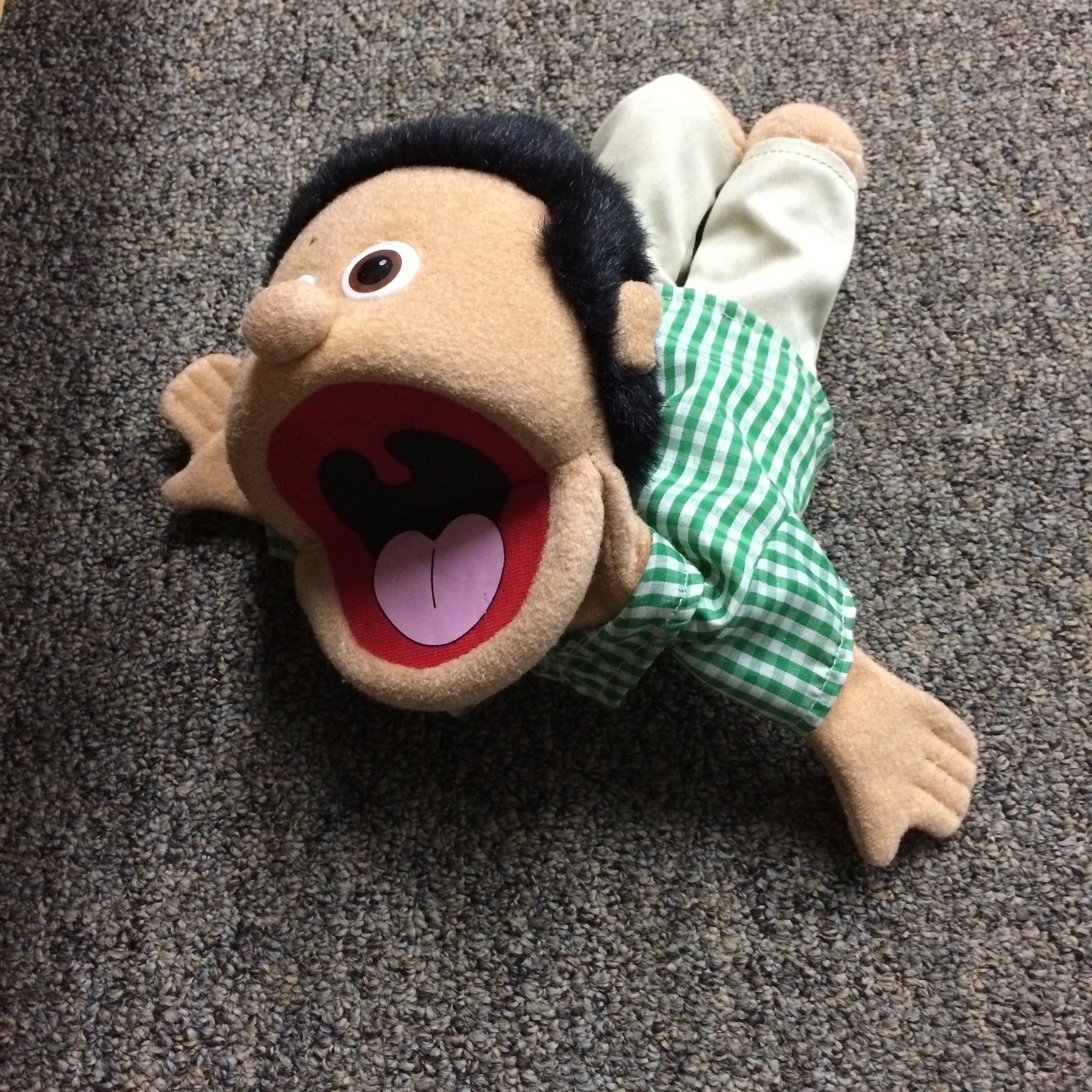 A Muppet-like man in a push-up position with his mouth wide open.