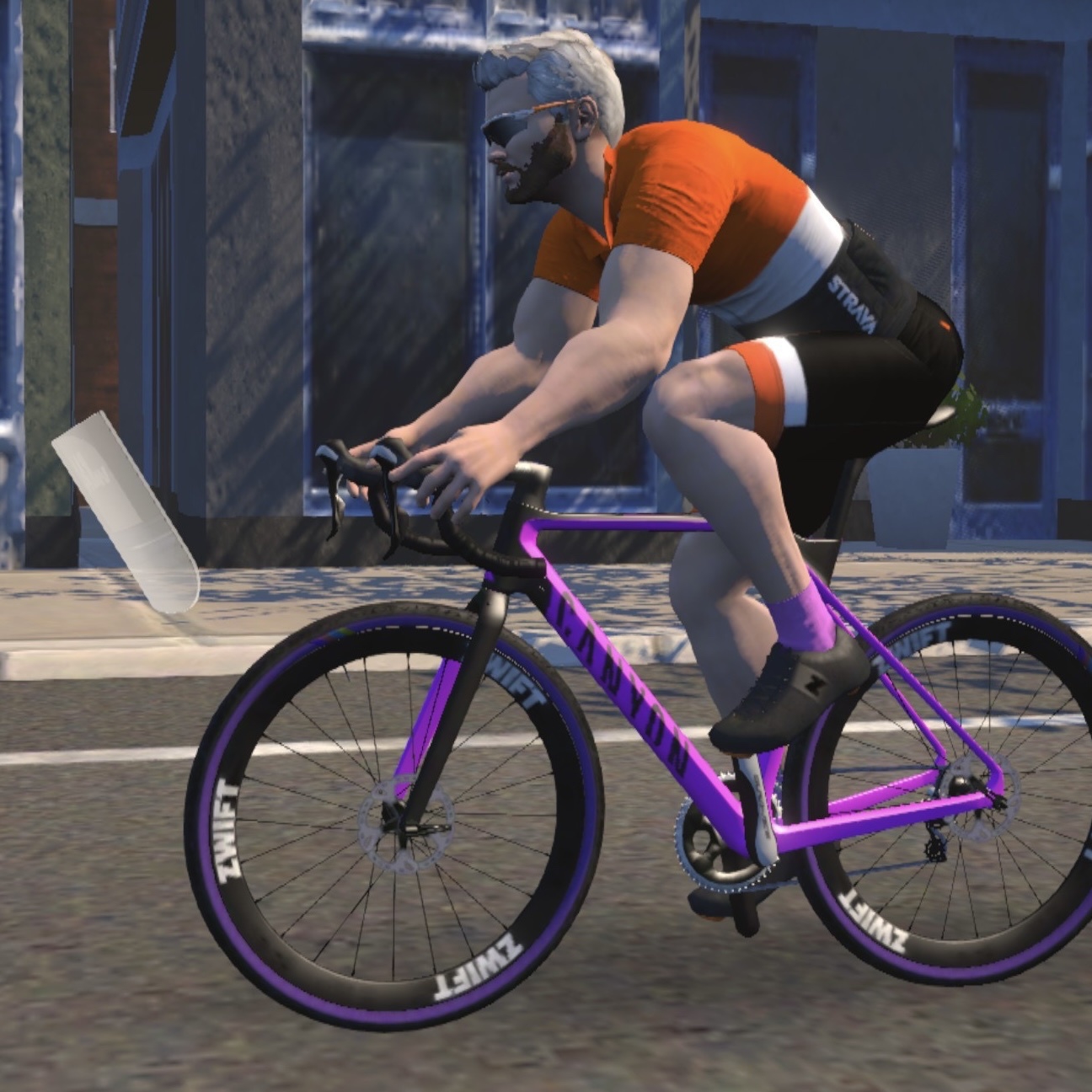 Avatar in the virtual cycling training app zwift on a pink Canyon Inflite CF bike.