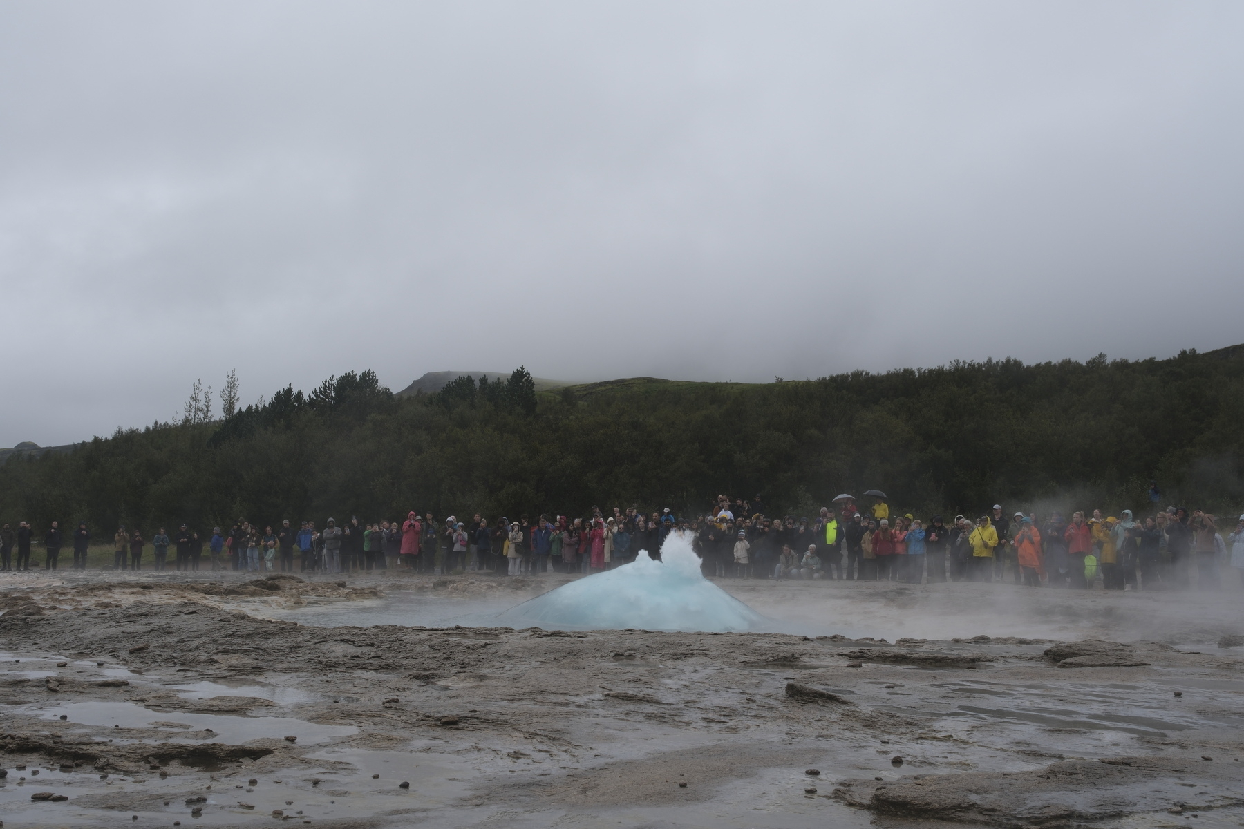 Strokkur geyser erupts.