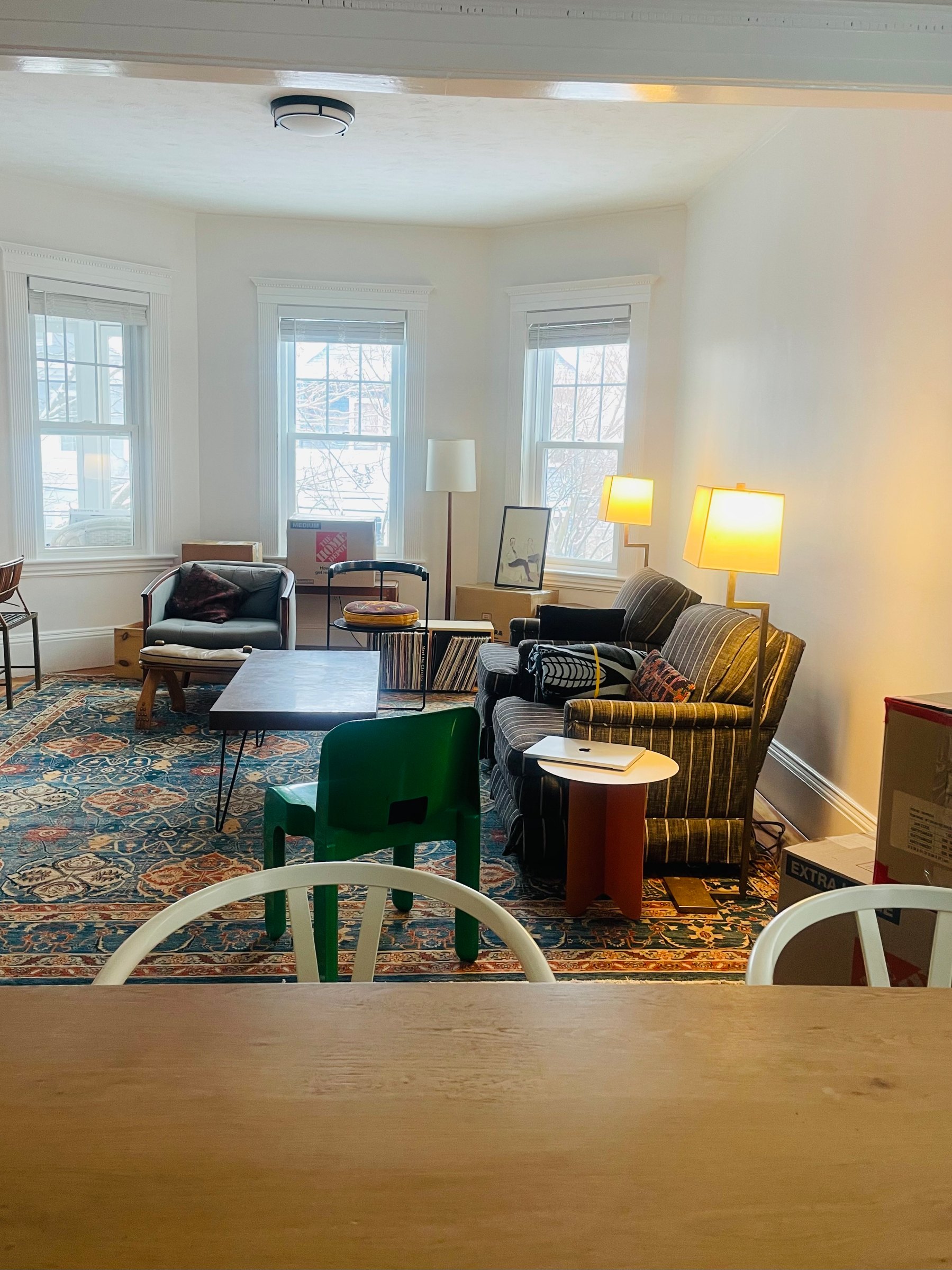A shot of our living room with furniture, records, artwork strewn about. 