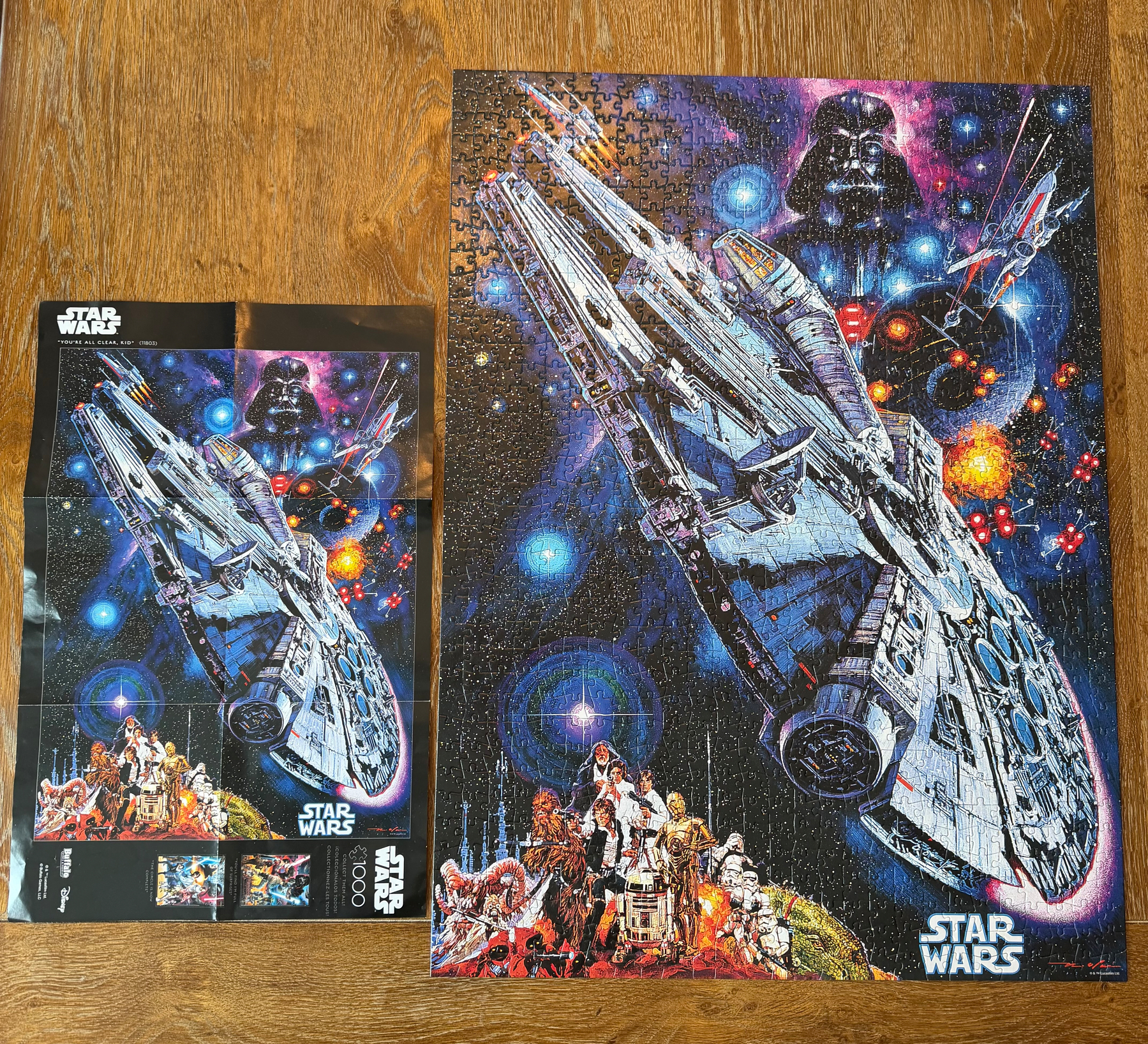 A completed Star Wars puzzle features the Millennium Falcon, Darth Vader, and several characters against a cosmic background.