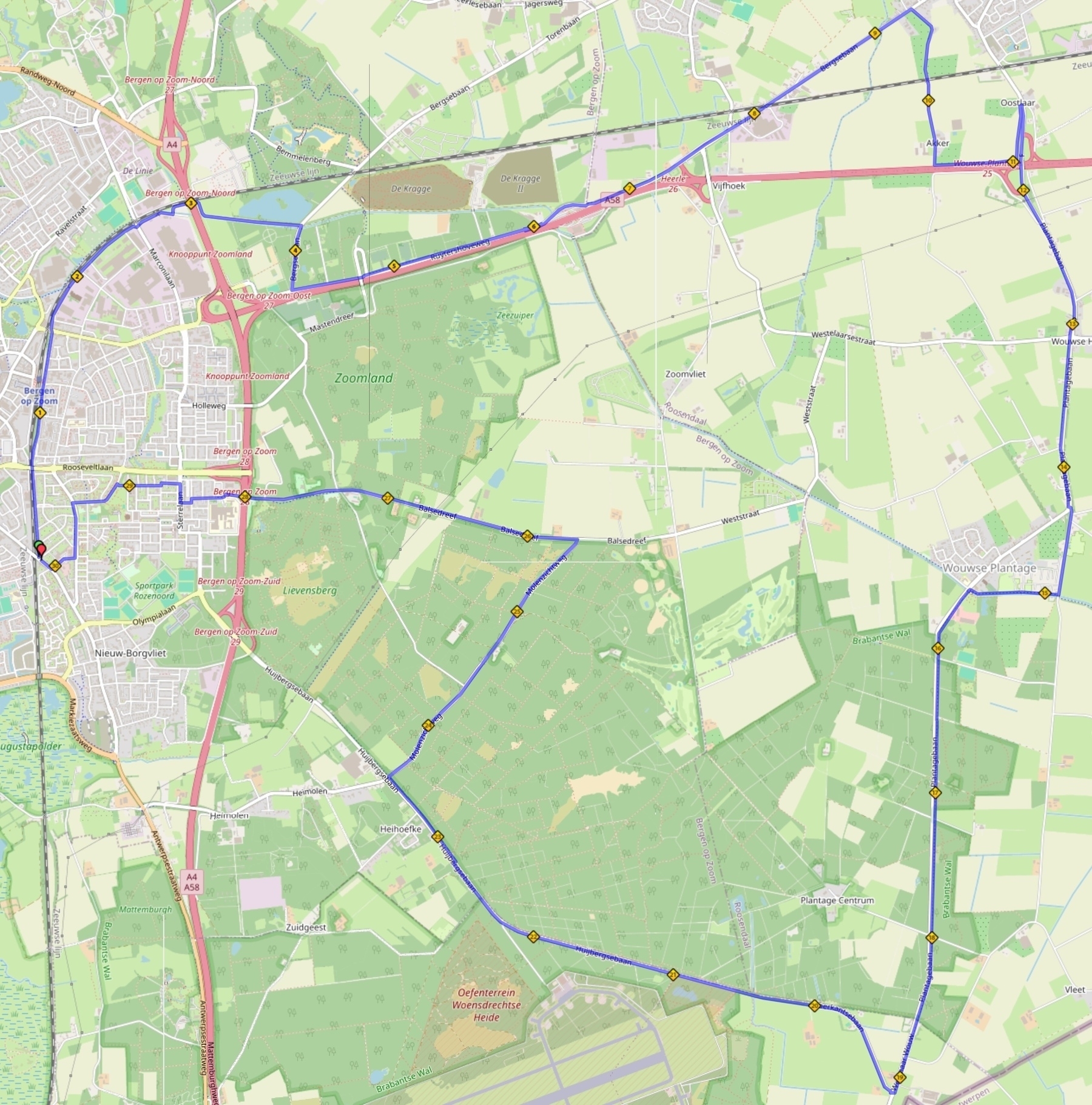Een geografische kaart toont een blauw omlijnde route die door stedelijke en landelijke gebieden loopt, met verschillende oriëntatiepunten en wegen die onderweg zijn gemarkeerd.