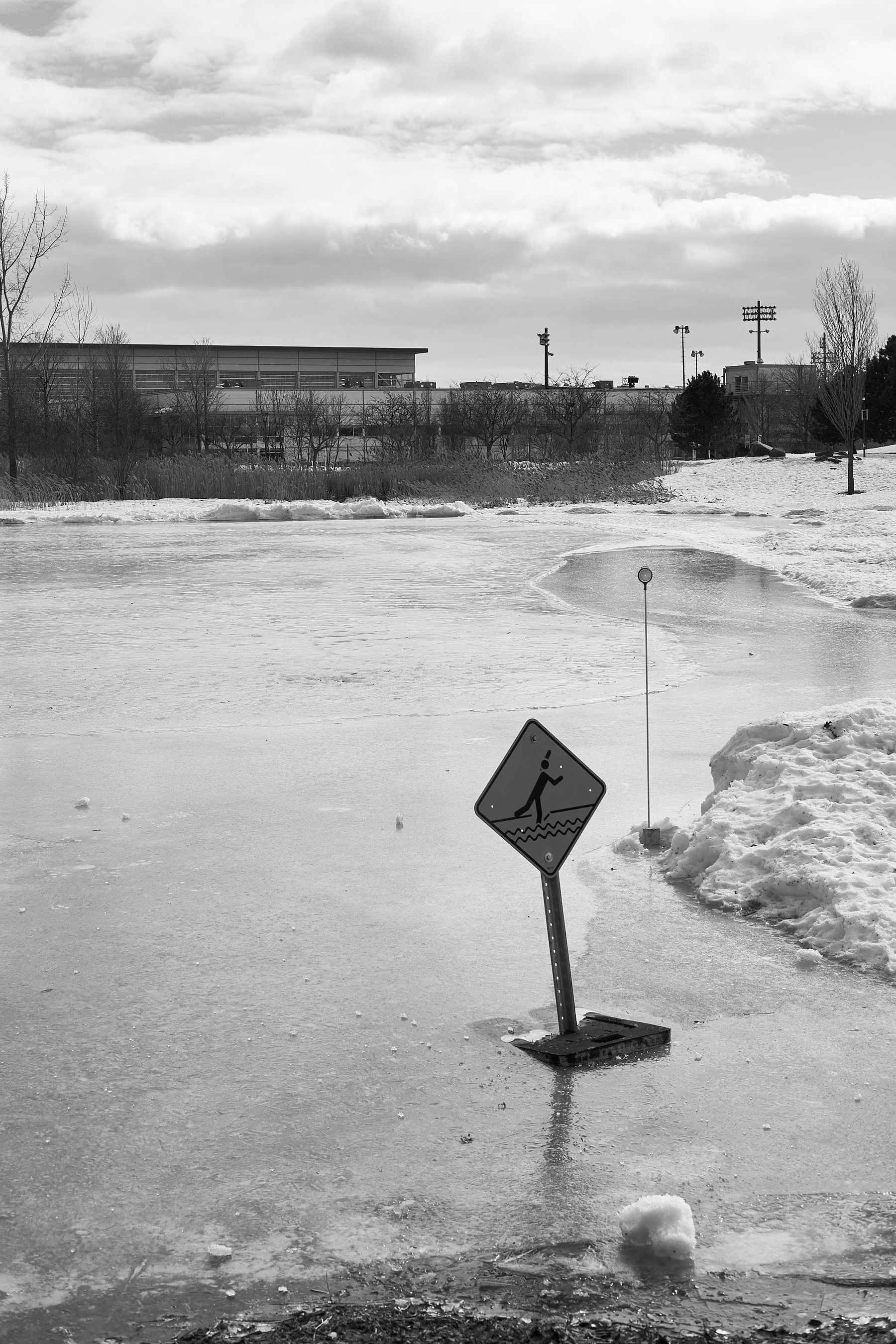 The ice has a warning sign on it. It is thin.