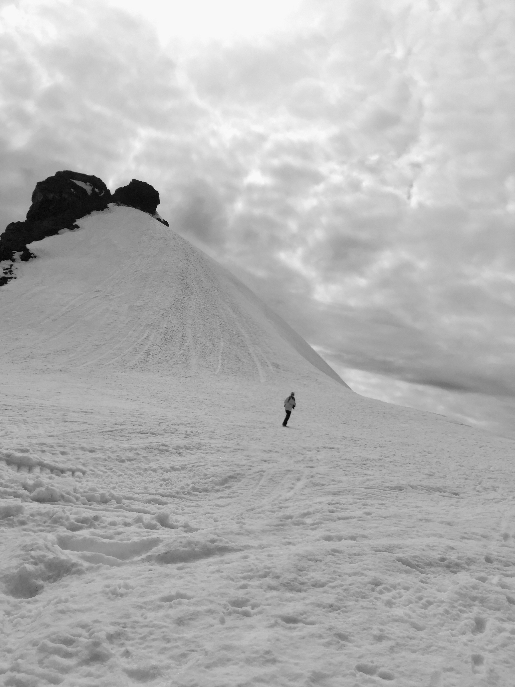 One person walks down the peak