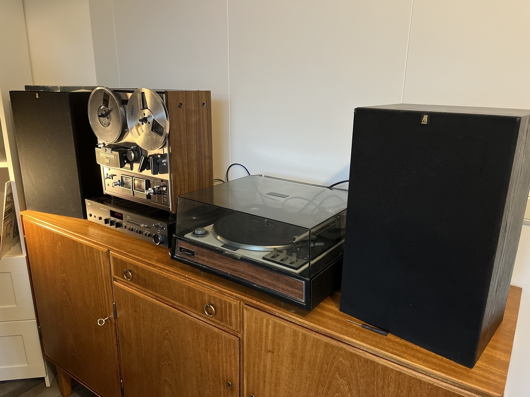 A fifty year record player, next to a fifty year reel-to-reel tape deck. Both in perfect working order.