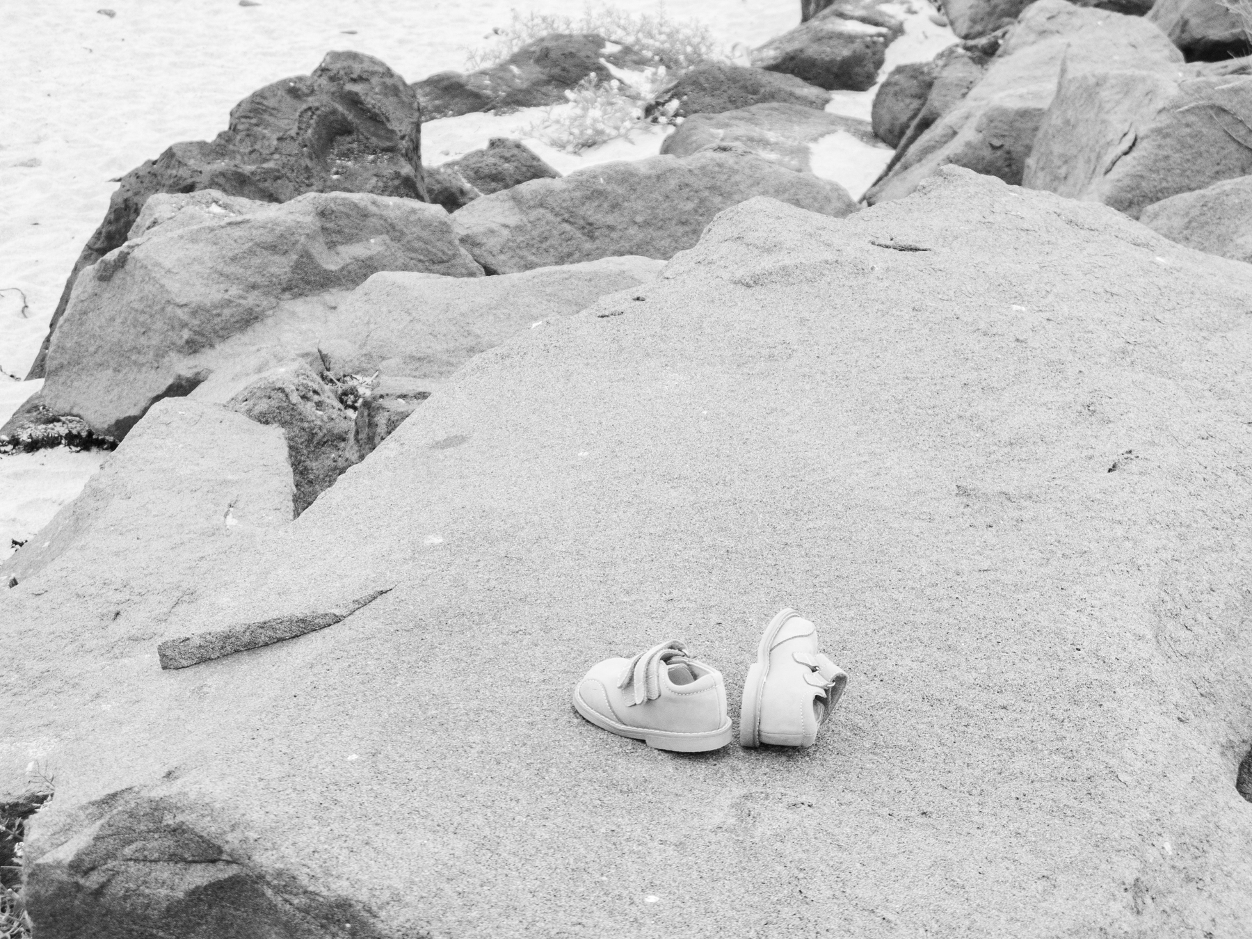 Somebody had taken their shoes off and left them on the rocks.