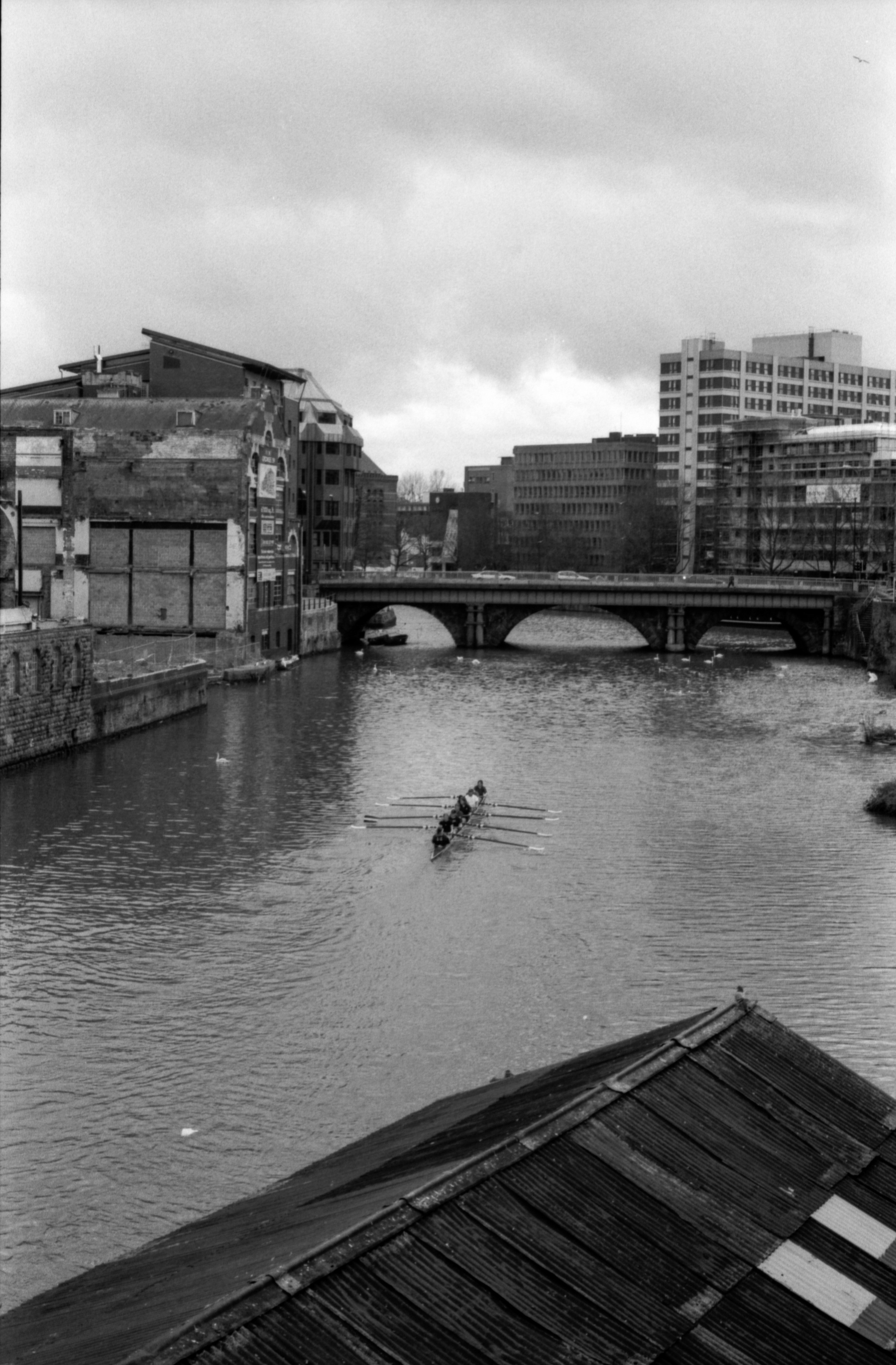 Competitive rowers practice on the river Avon in Bristol