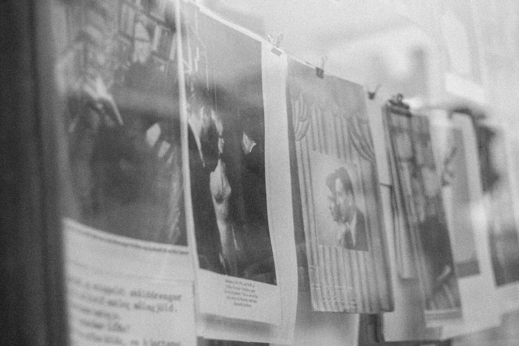 A picture of the display window of the used book store in Hverfisgata. The owner has hung a series of prints with captions on a clothesline.