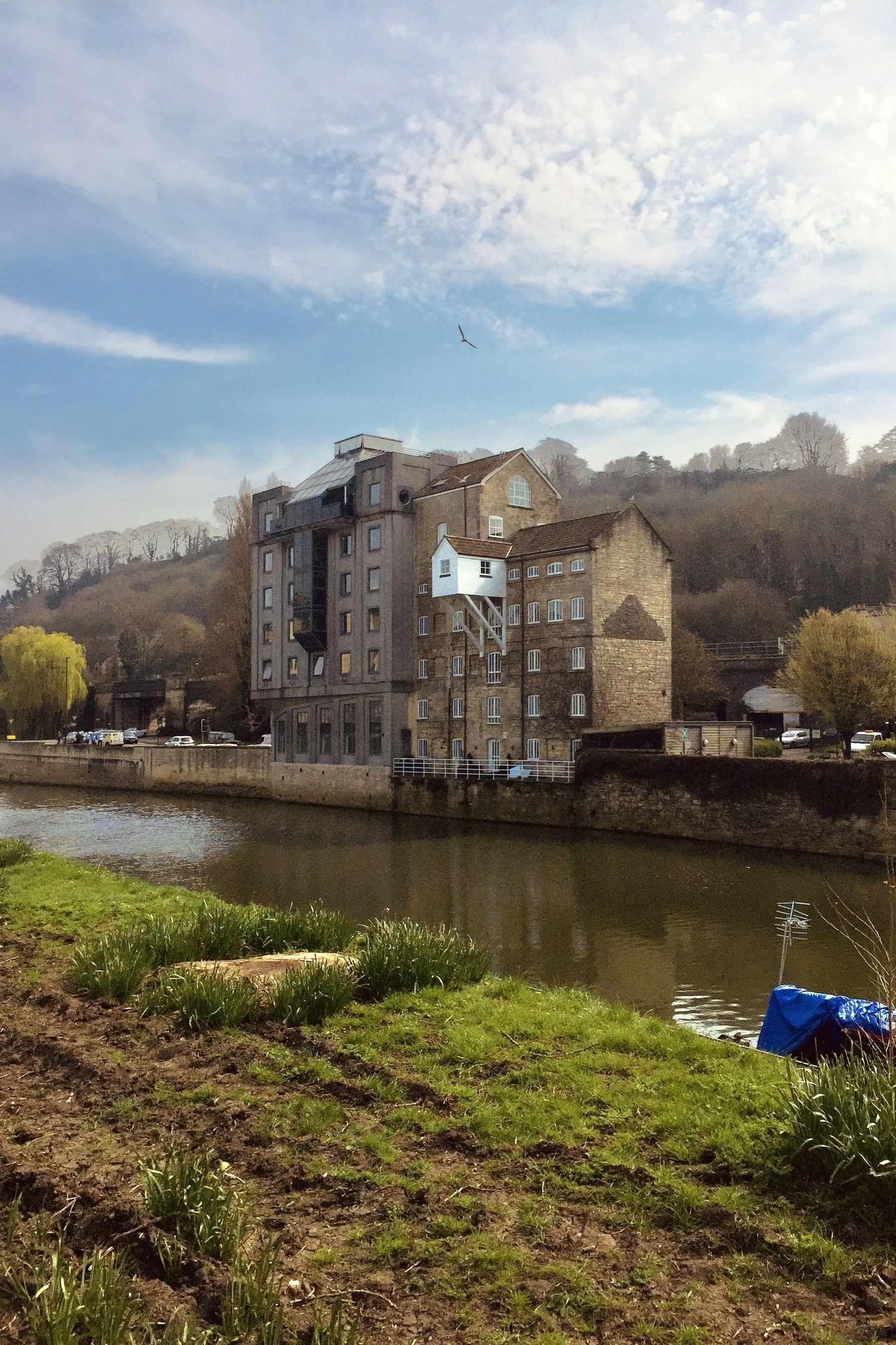 Another photo from the riverside in Bath. This time colour. An old building juts out from the banks of the river in a weird way.