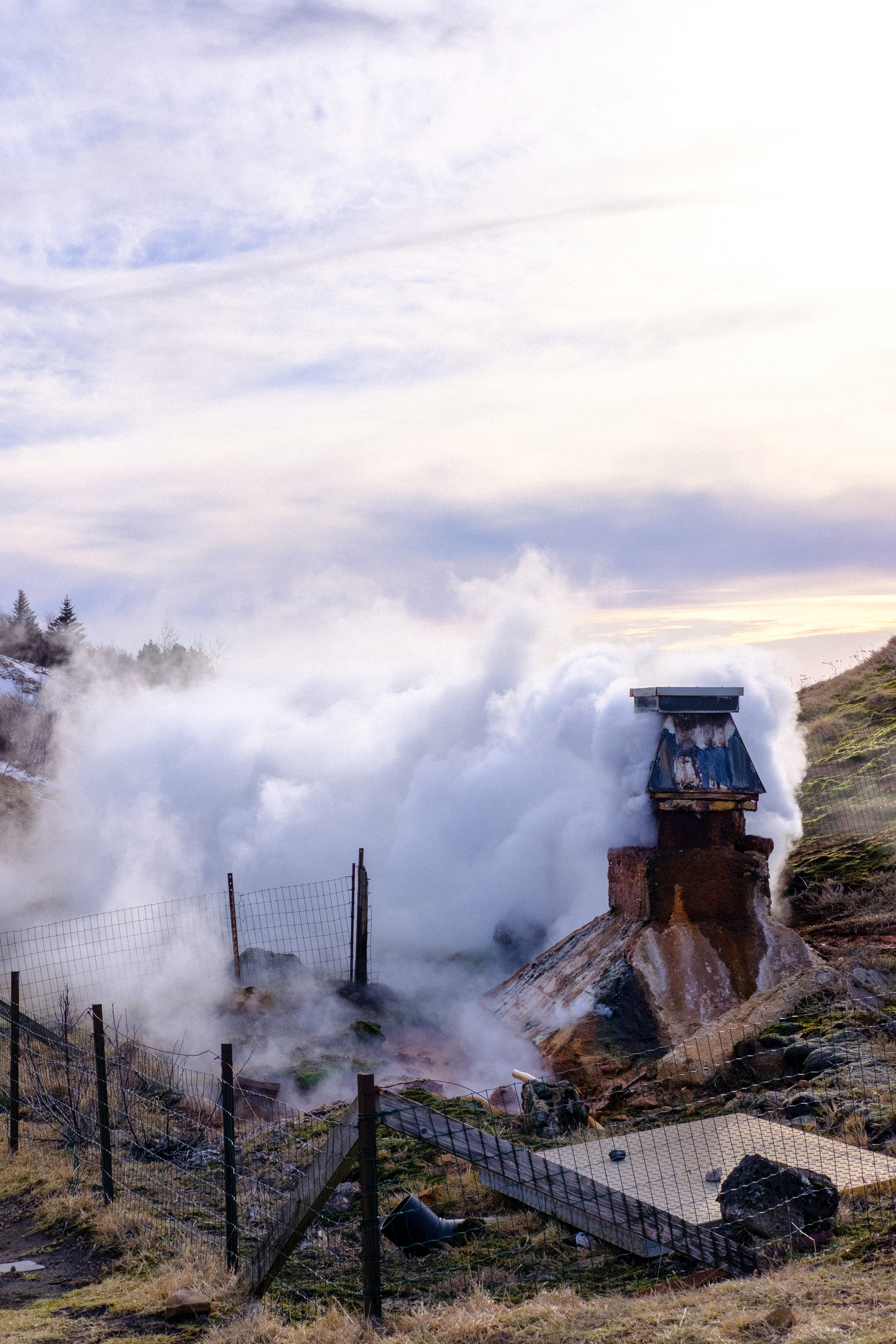 Steam rises from a geothermal well near one of the hotels