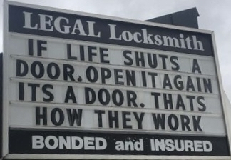 A sign that reads: “If life shuts a door, open it again, it’s a door. That’s how they work.”