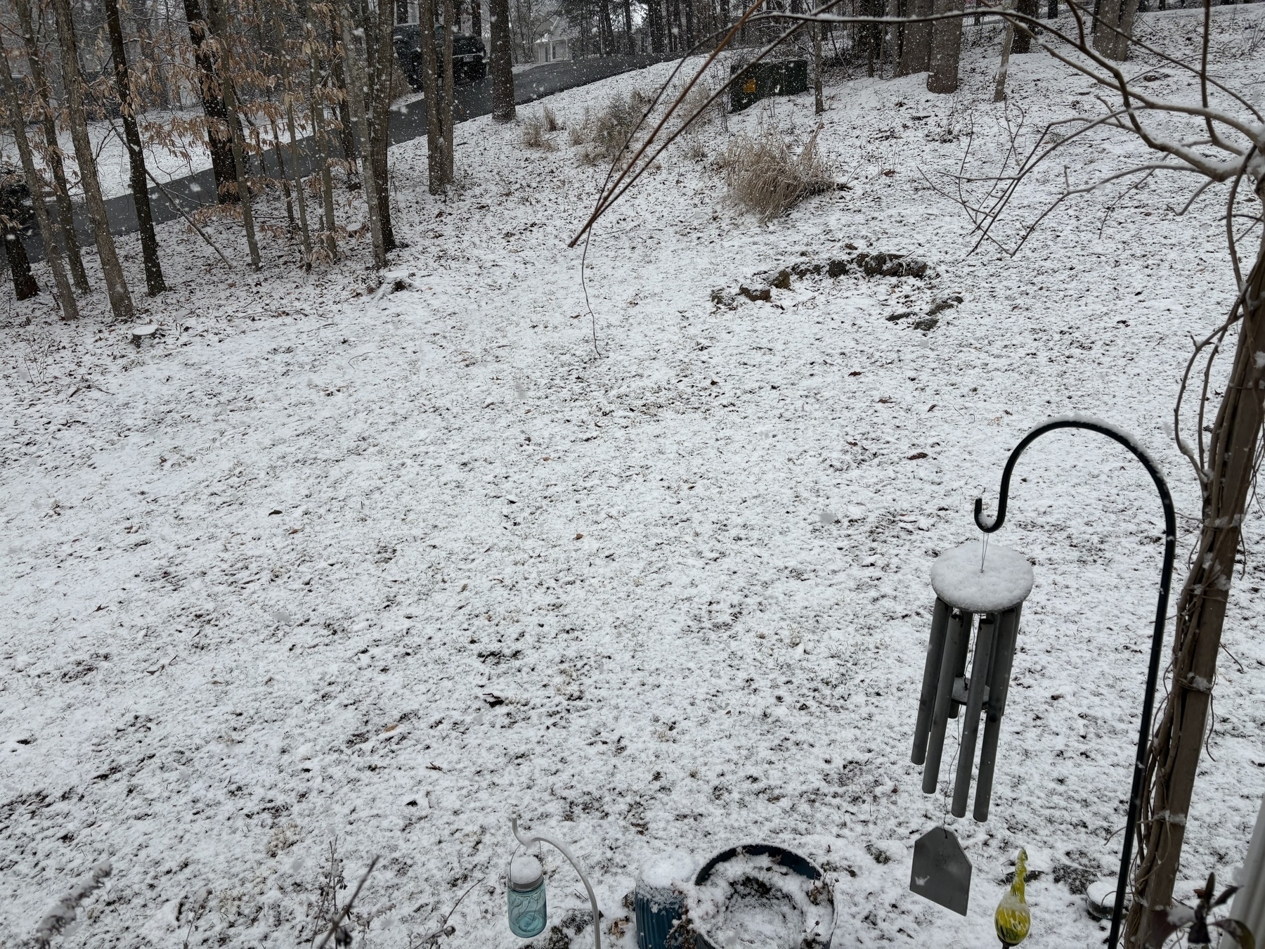 A picture of our front yard covered in a layer of snow.