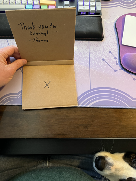 A photo of the inside of a physical copy of Mesh Network, with a thank you note inside it