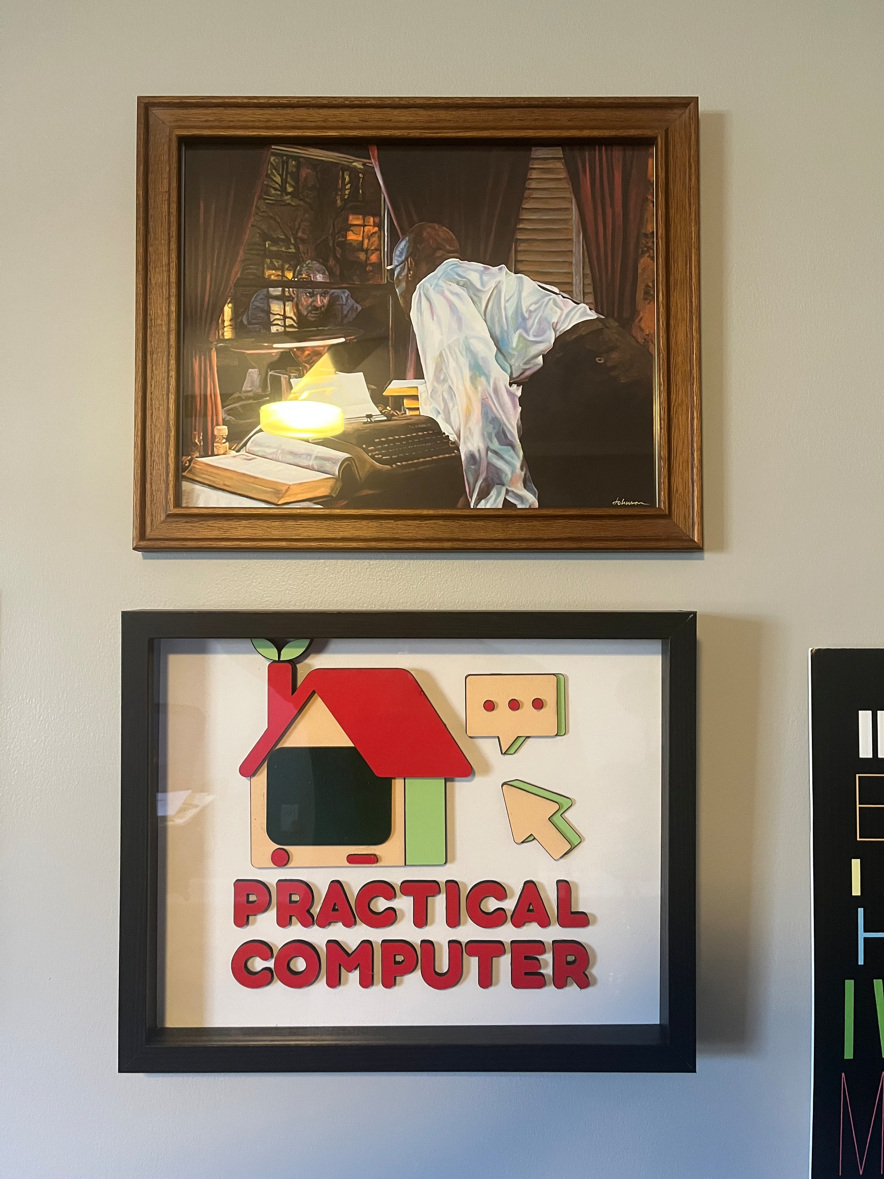 A sunlit photo of a shadow-boxed, CNC-d, painted version of the Practical Computer logo. It is hung under an oil painting of an iconic scene from Deep Space Nine’s “Far Beyond The Stars”