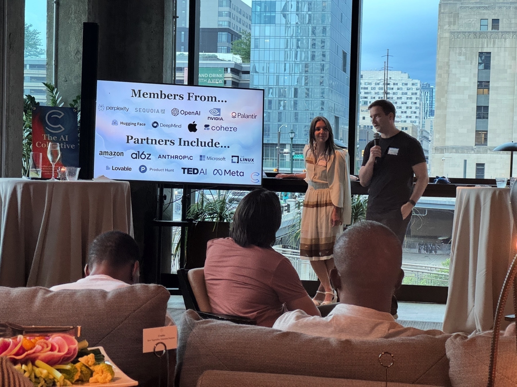 Photo of two hosts talking about the AI Collective mission.