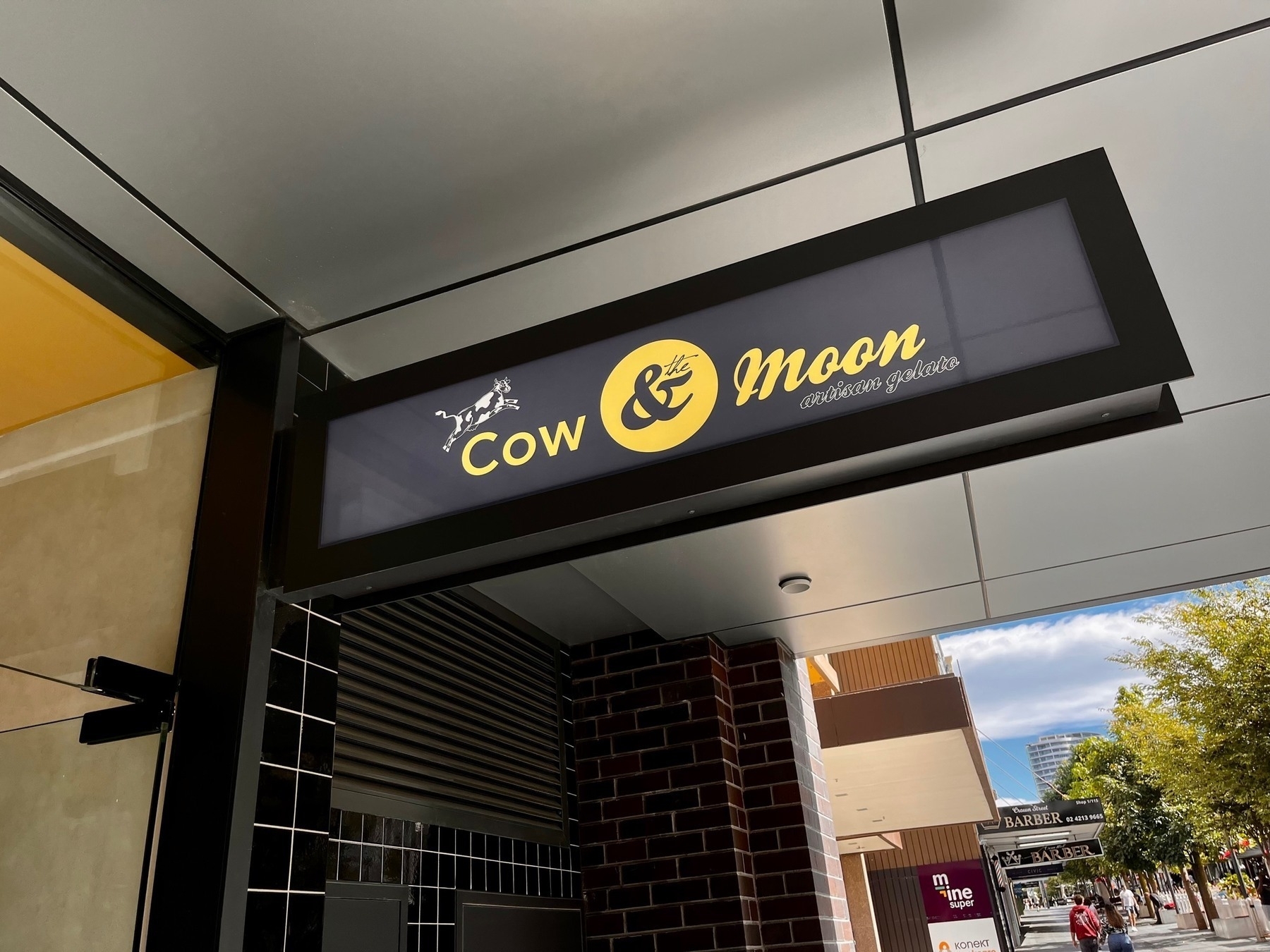 Hanging 'Cow and the Moon' sign