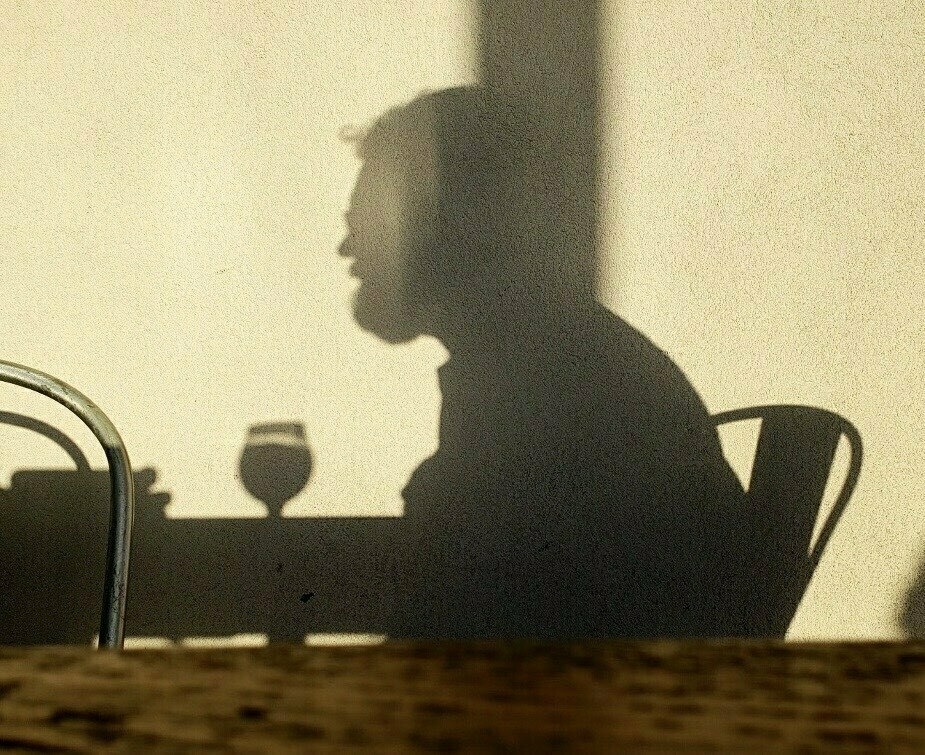 Silhouette at table