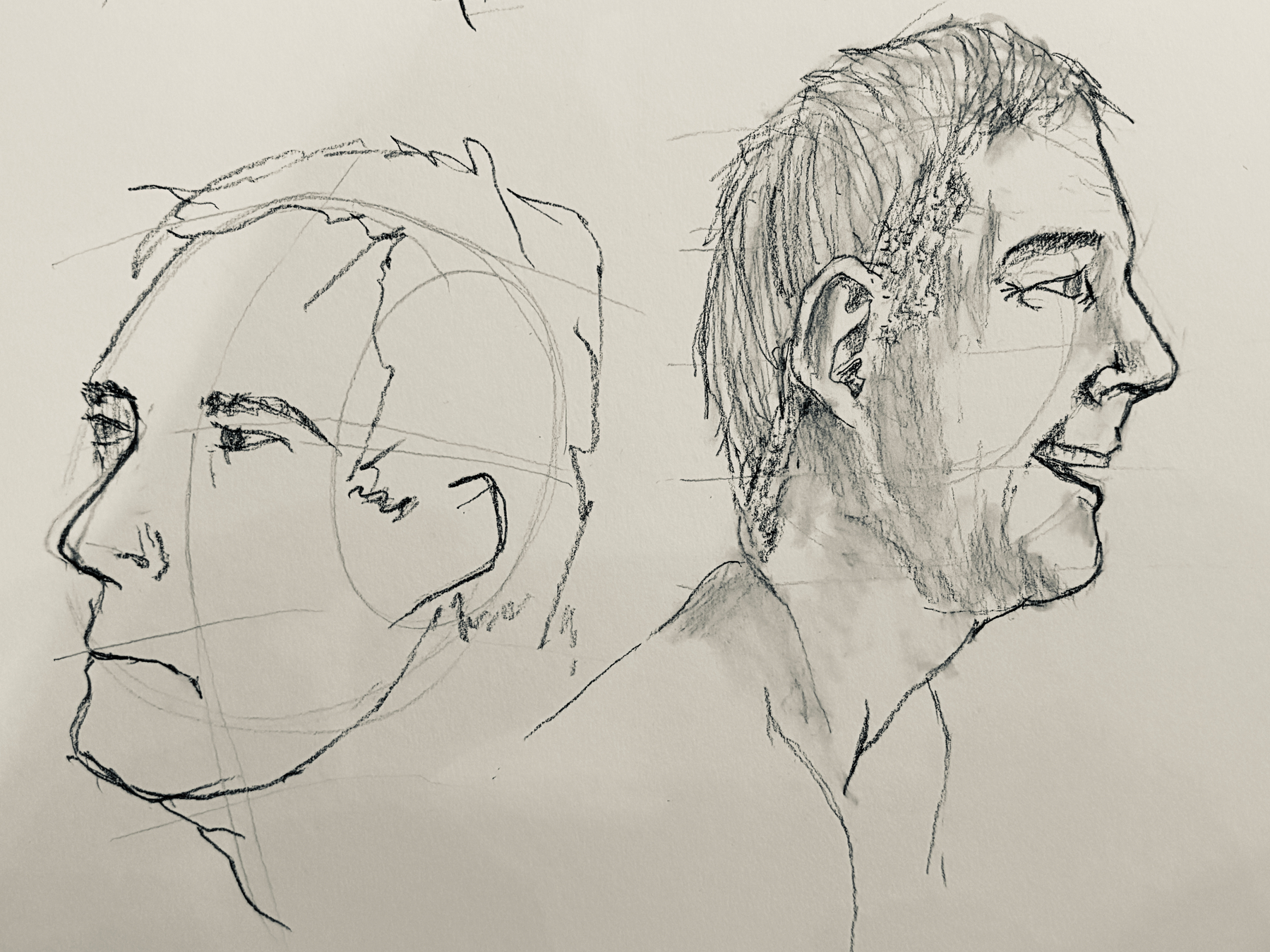 A sketch of two male profiles, one with a neutral expression and the other slightly smiling.