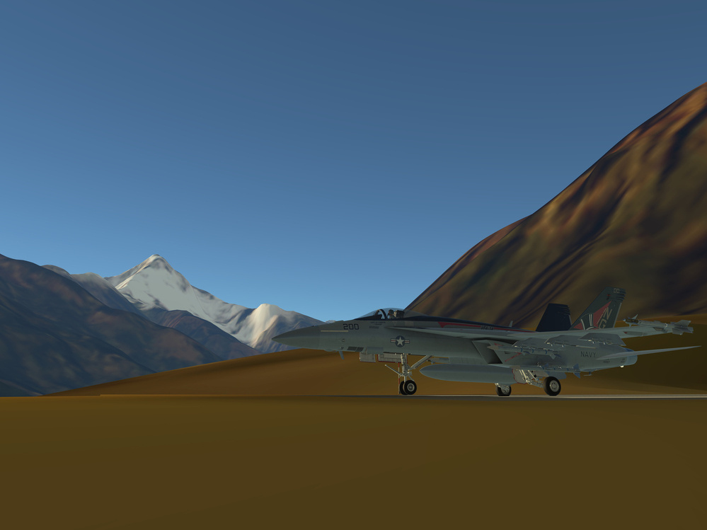 A fighter jet is parked on a runway amidst a mountainous landscape with a snowy peak in the background.