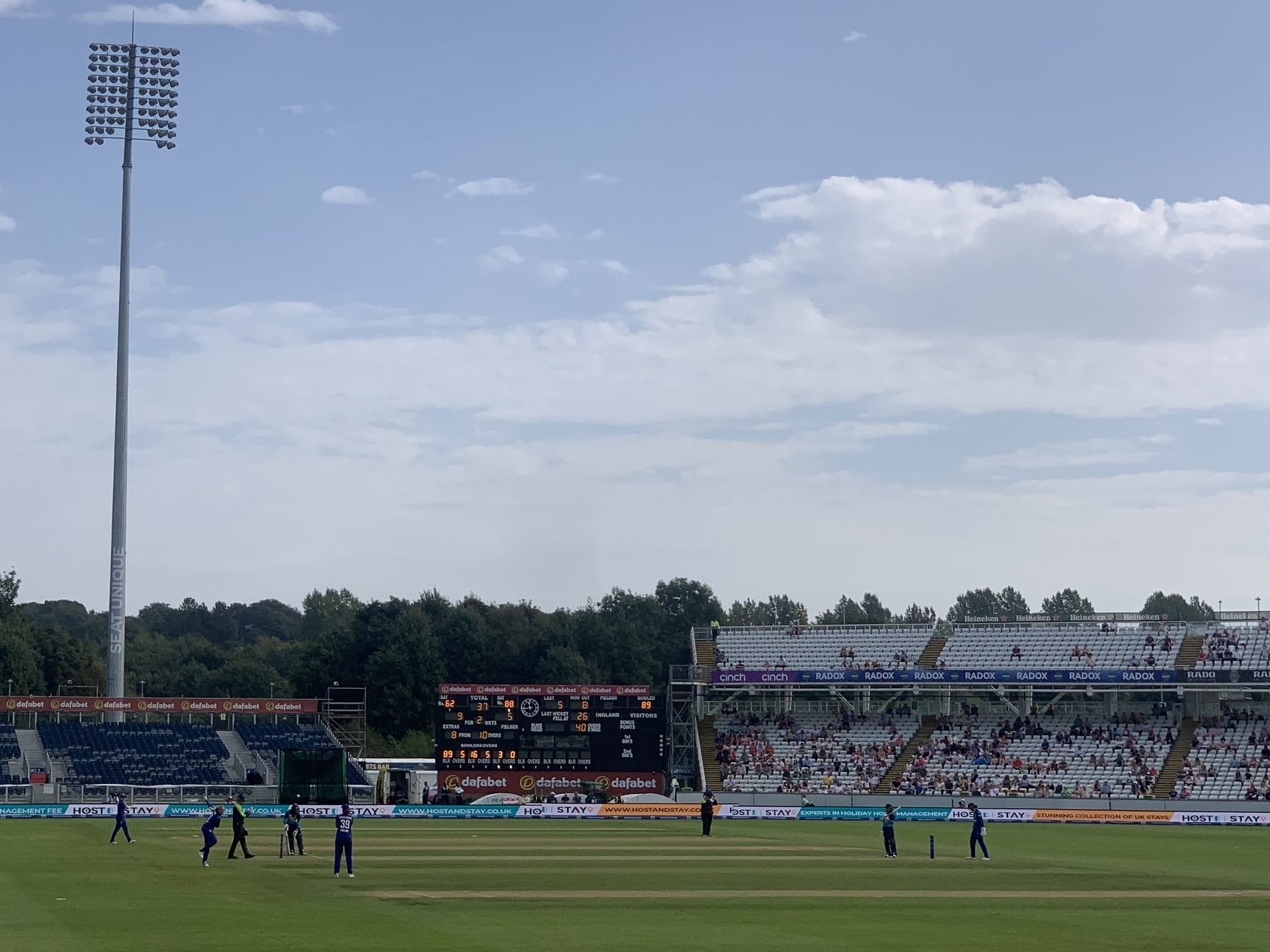 England and Sri Lanka on the cricket field at Chester le Street. Scoreboard and stands in the background.