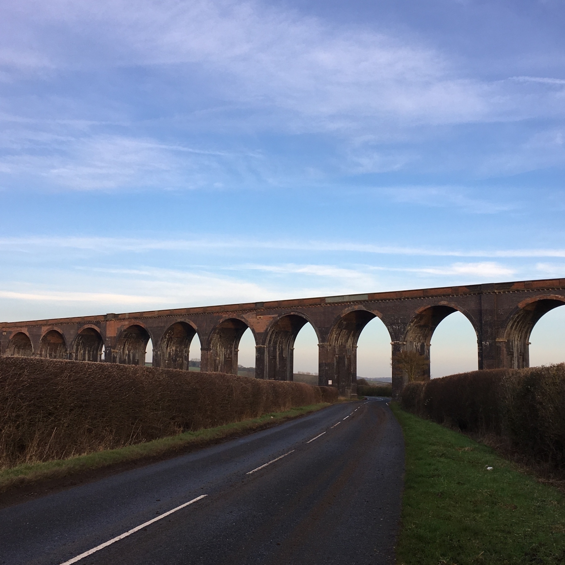 Viaduct crossing a country road
