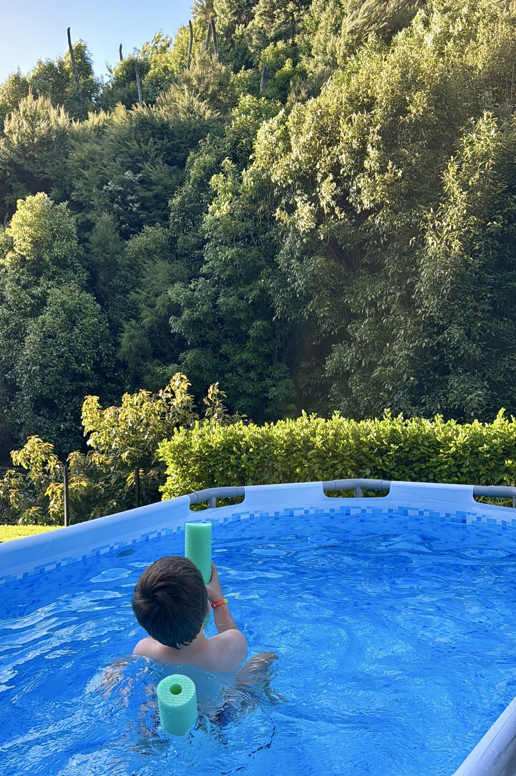 My son in a pool on a hot summer’s day
