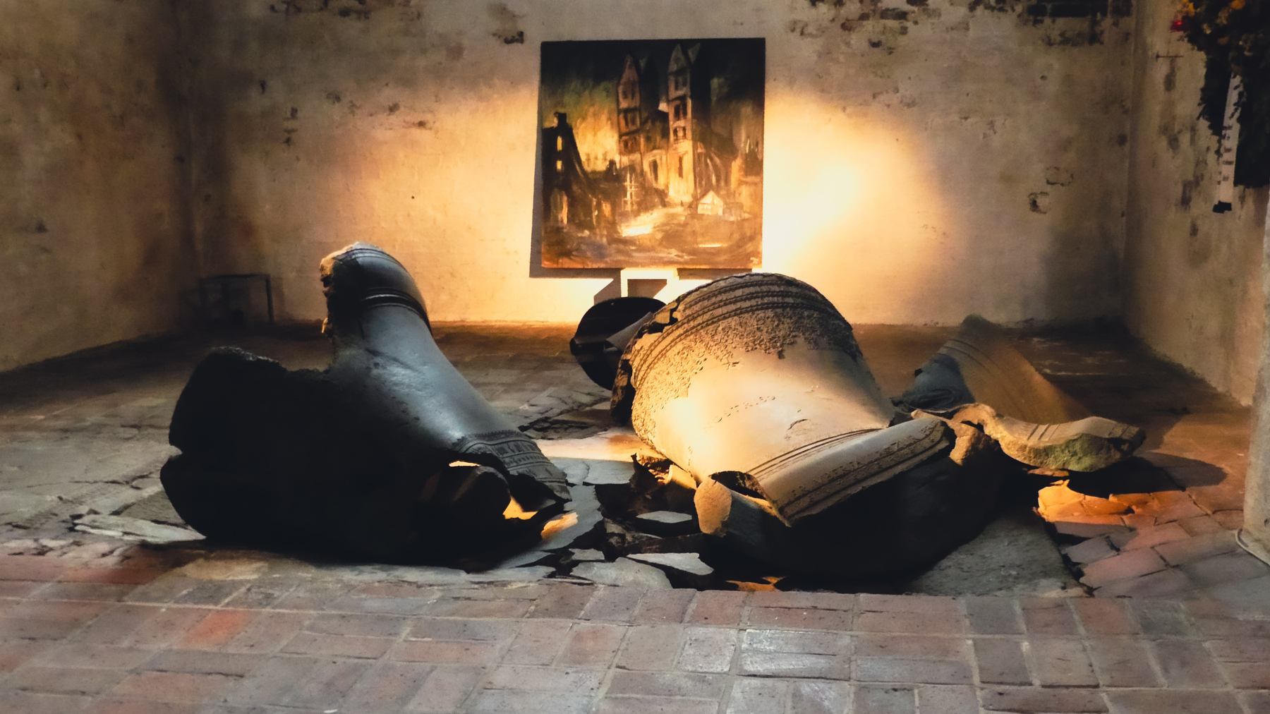 Pieces of a large church bell which lay broken on the floor in the St. Mary’s Church 