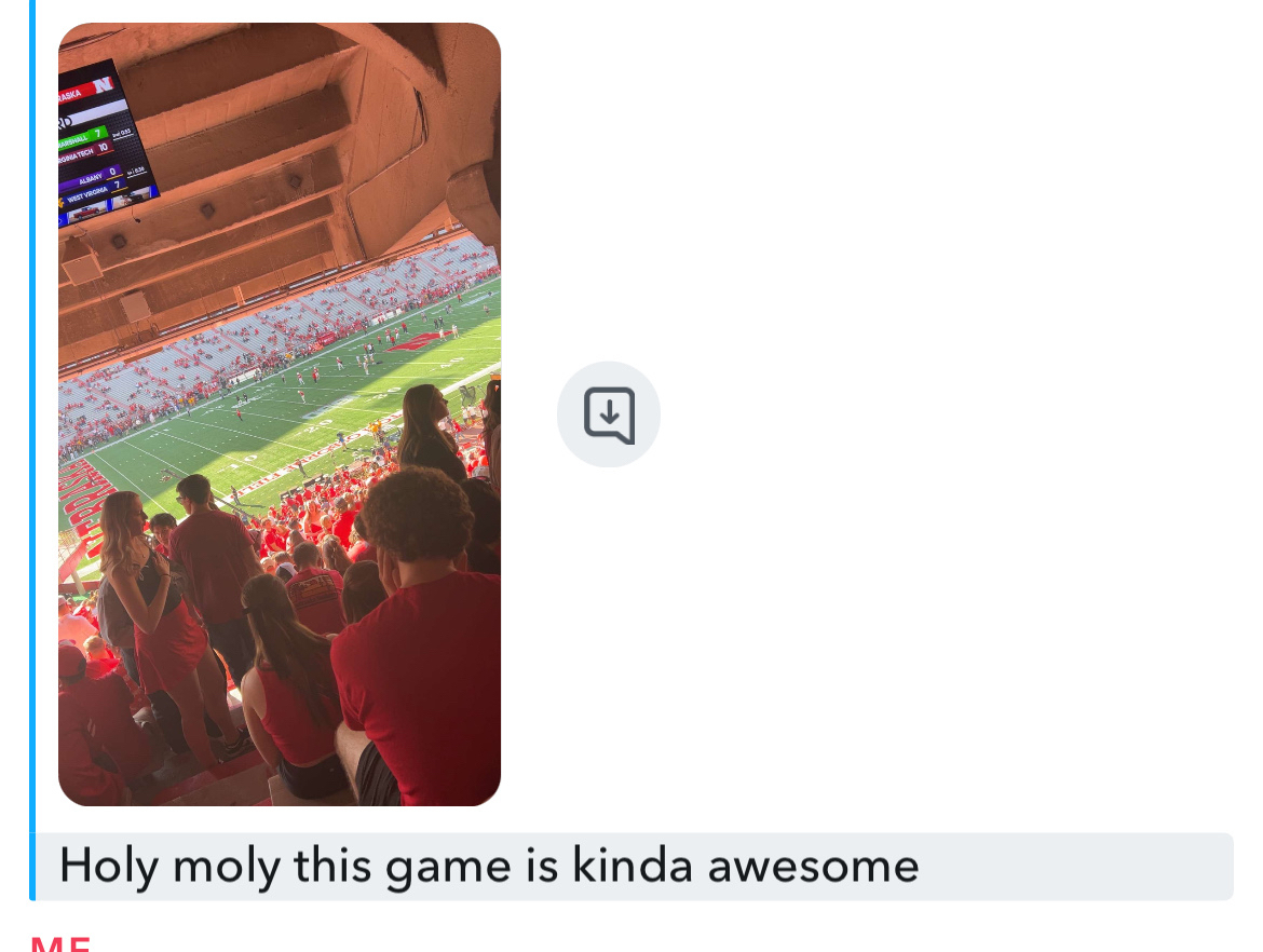 A picture from the student section of the game with the message “holy moly this game is kinda awesome”