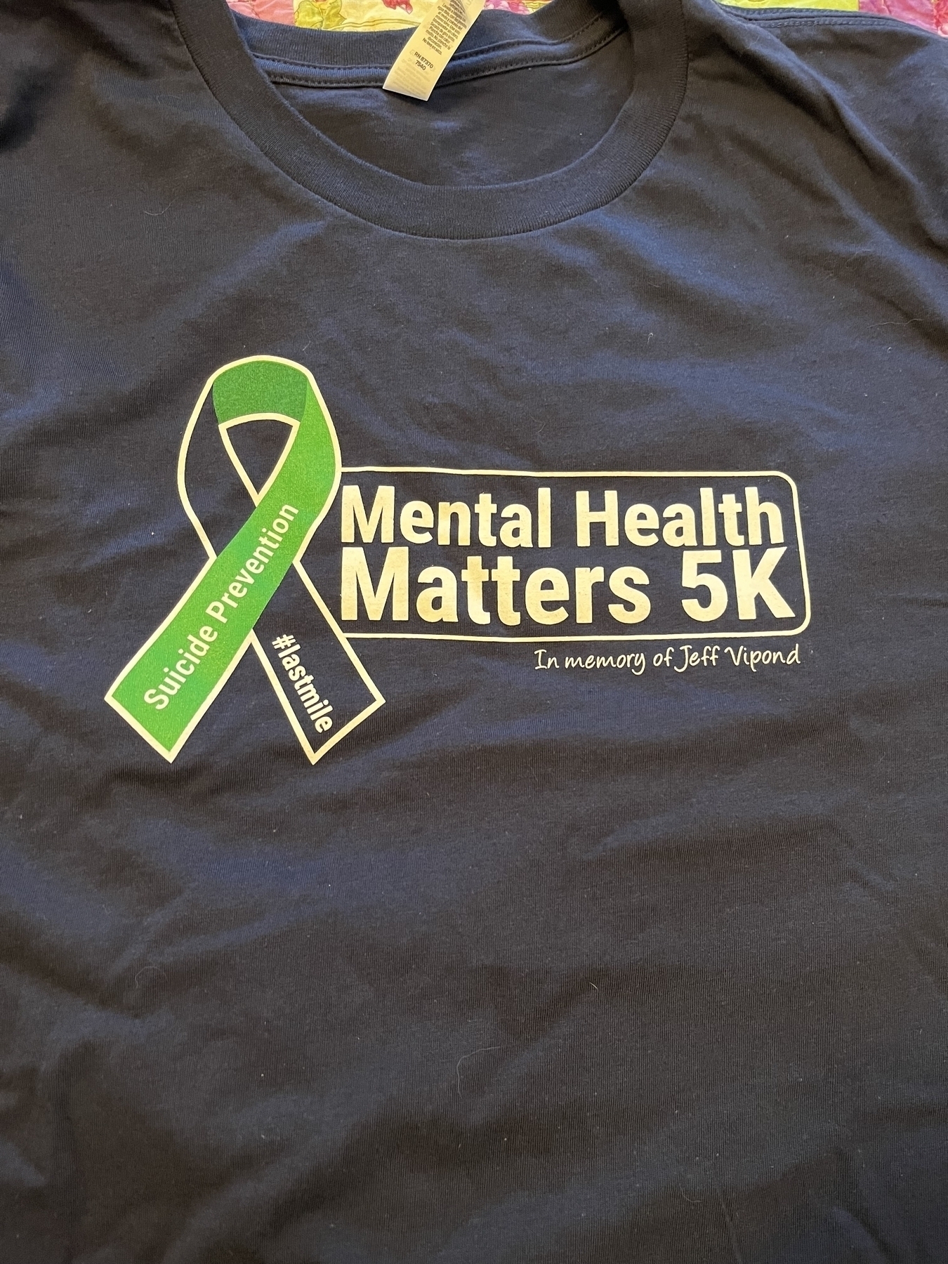 Photo of a black shirt advertising the Mental Health Matters 5k race