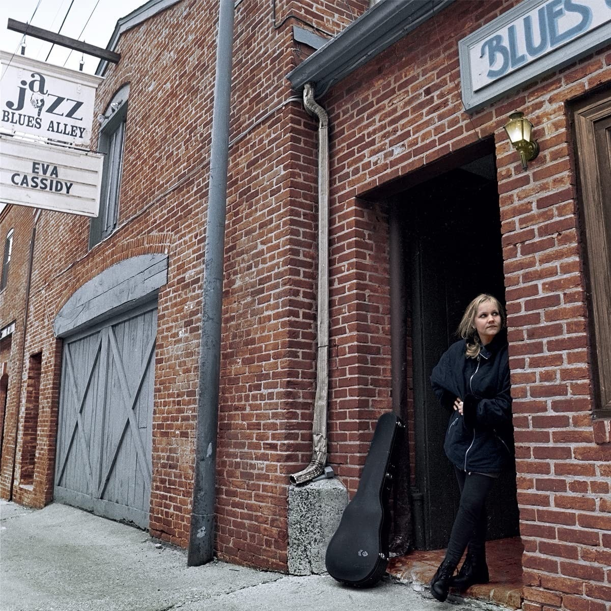 Eva Cassidy’s album cover photo with her leaning on that same brick wall with the same sign in the top of the photo