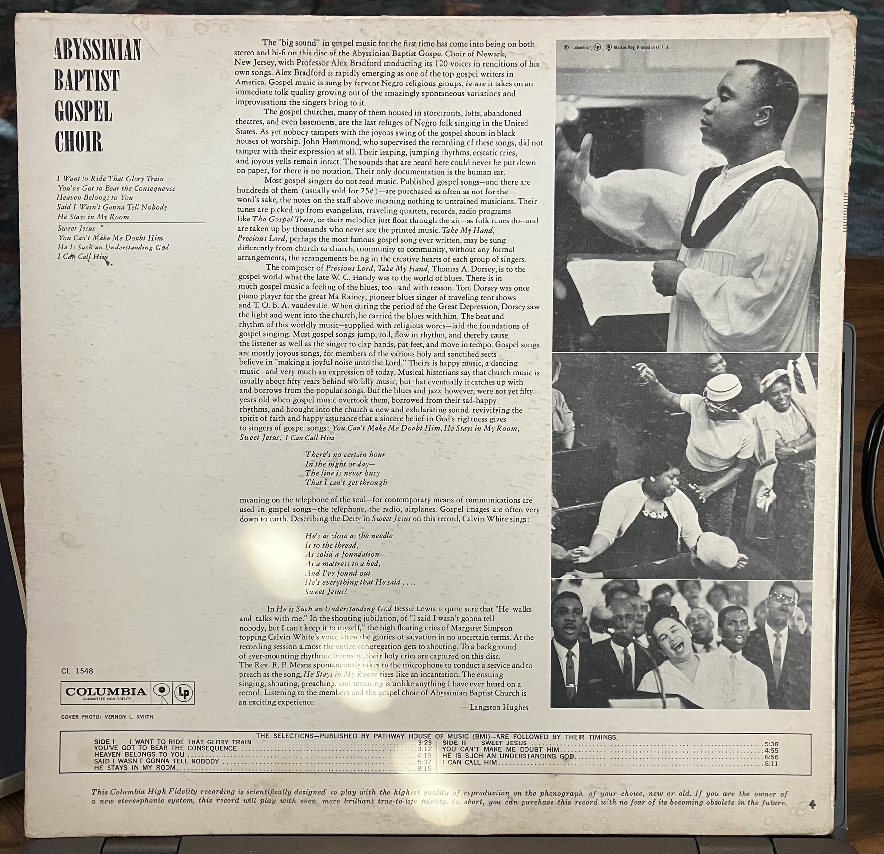 Backside of album cover with pictures of the choir singing and liner notes