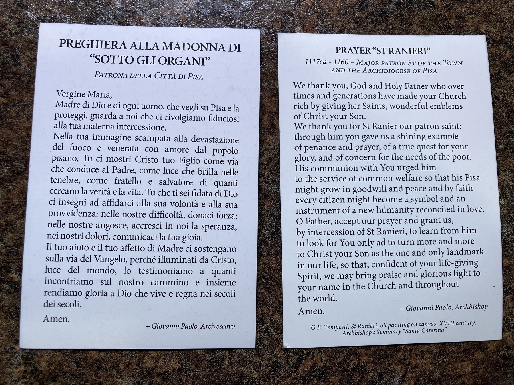 Auto-generated description: The image shows two texts side by side, one in Italian and one in English, containing prayers and religious invocations to the Madonna of Pisa and Saint Ranieri.