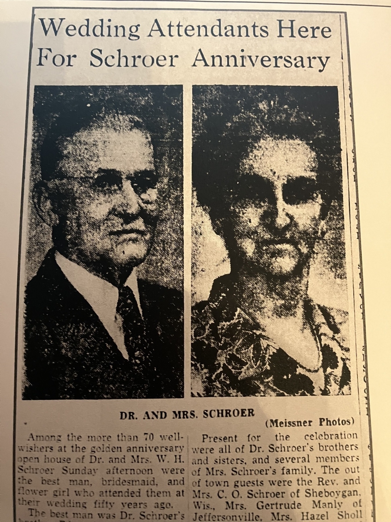 Auto-generated description: A newspaper clipping features a photo of an older couple, Dr. and Mrs. Schroer, along with a caption detailing their wedding anniversary celebration.