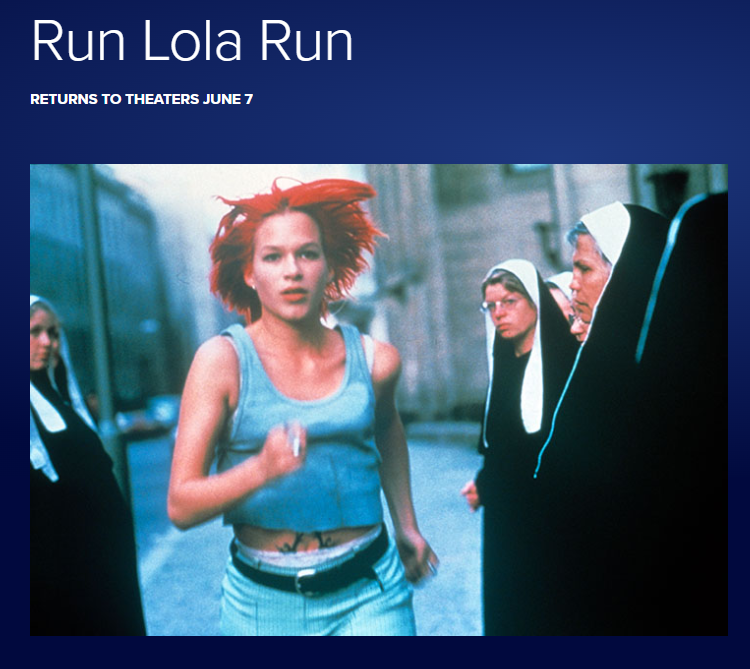 A still image of Franke Potente as Lola, running past a group of nuns from the film Run, Lola, Run.