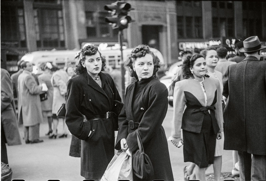 Black and white photo by Ruth Orkin of two young women on a New York City street in 1948