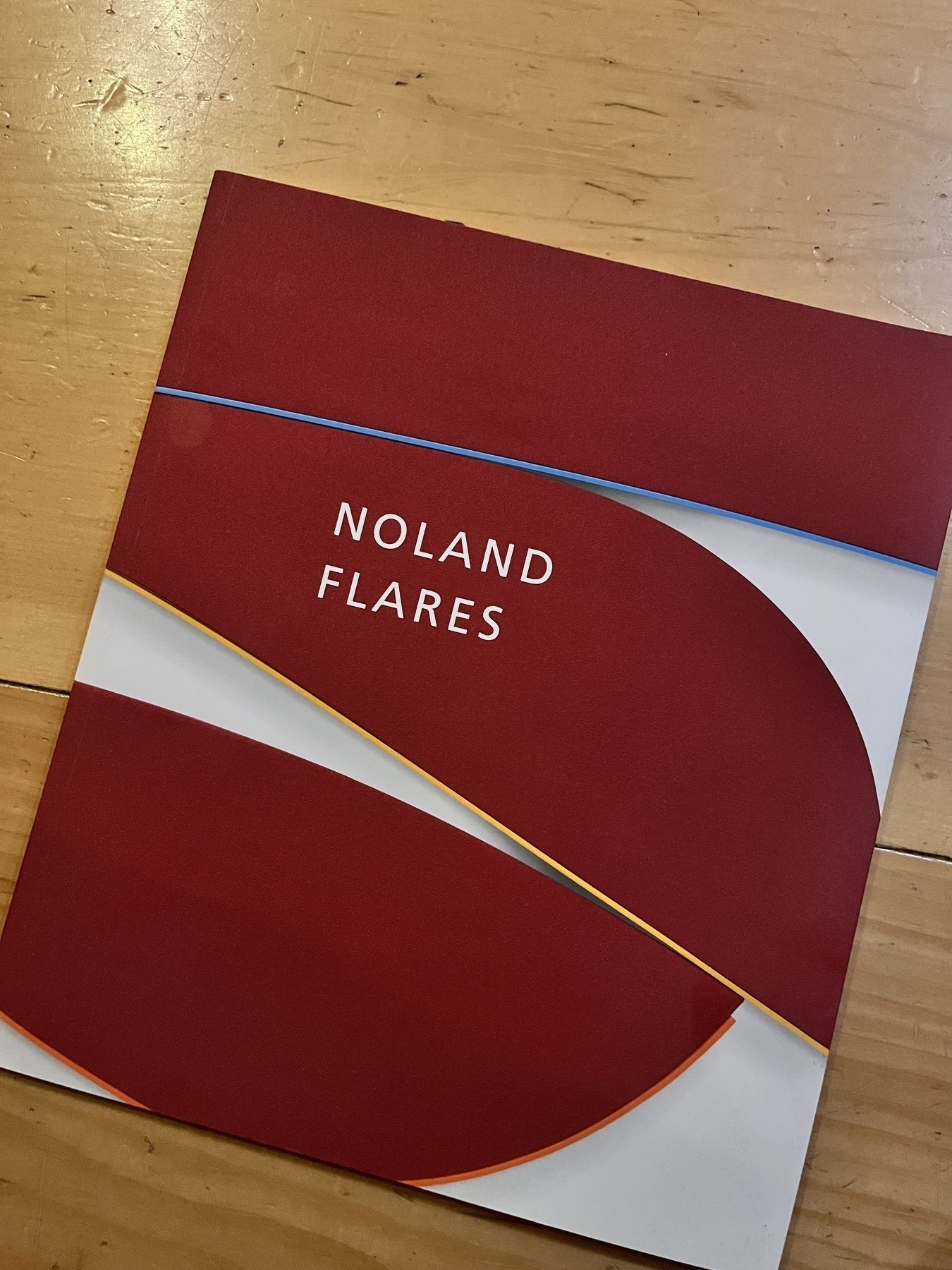 Book cover of a Ken Noland exhibition catalog. Red flares with white background. 