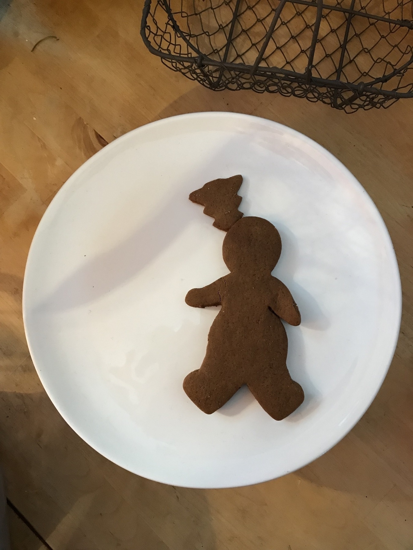 Gingerbread man with gingerbread tree stuck in his head