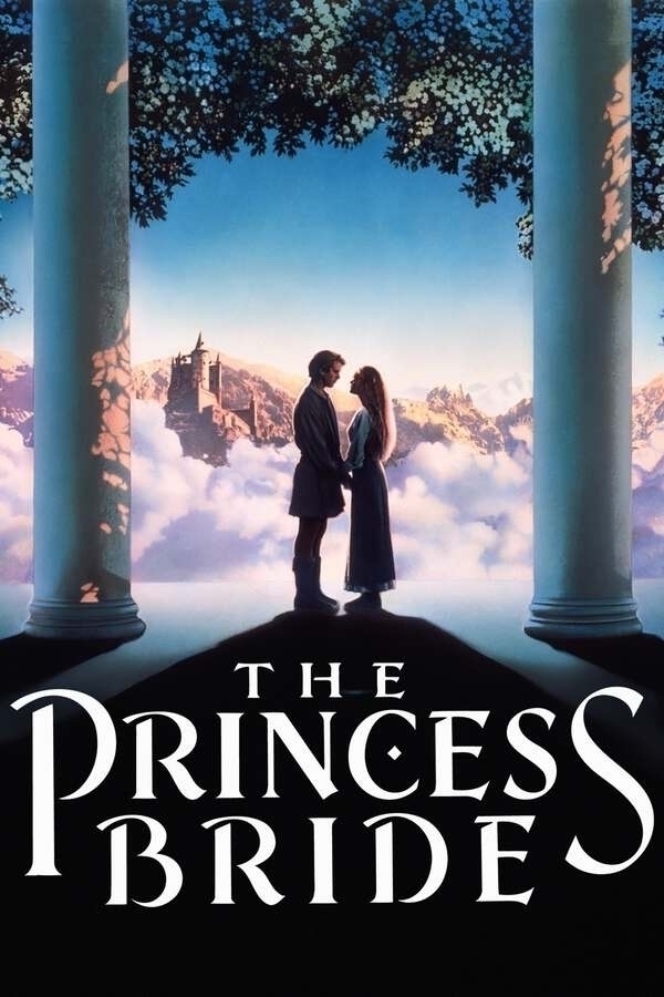 This is a movie poster for *The Princess Bride*. The image features a man and a woman standing close together, facing each other, and holding hands. They are silhouetted against a stunning backdrop of clouds and distant mountains, with a castle perched on a cliff in the background. The scene is framed by two large columns with foliage above, creating a dreamlike and romantic atmosphere. The title "The Princess Bride" is prominently displayed at the bottom of the poster in bold, stylized white text.