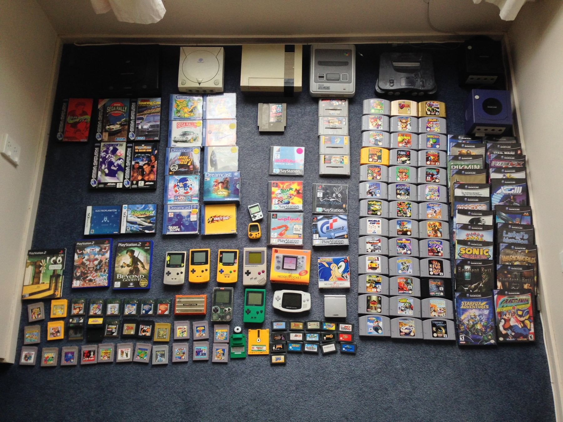 My video game collection at its peak. 7 game consoles, 12 handhelds and around 130 games. 