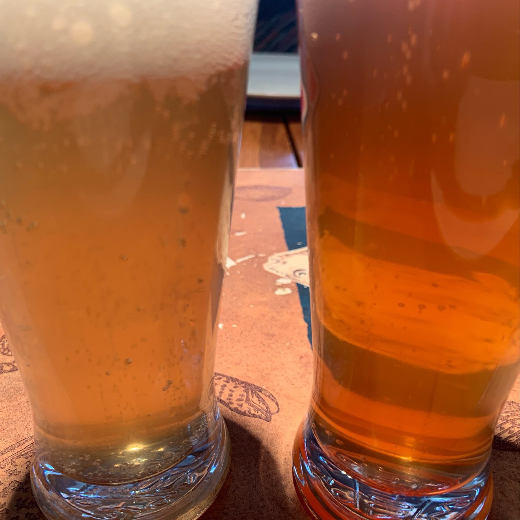 the lime beer on the left is beer uellow, the raspberry infused one on the right is distinctly pink