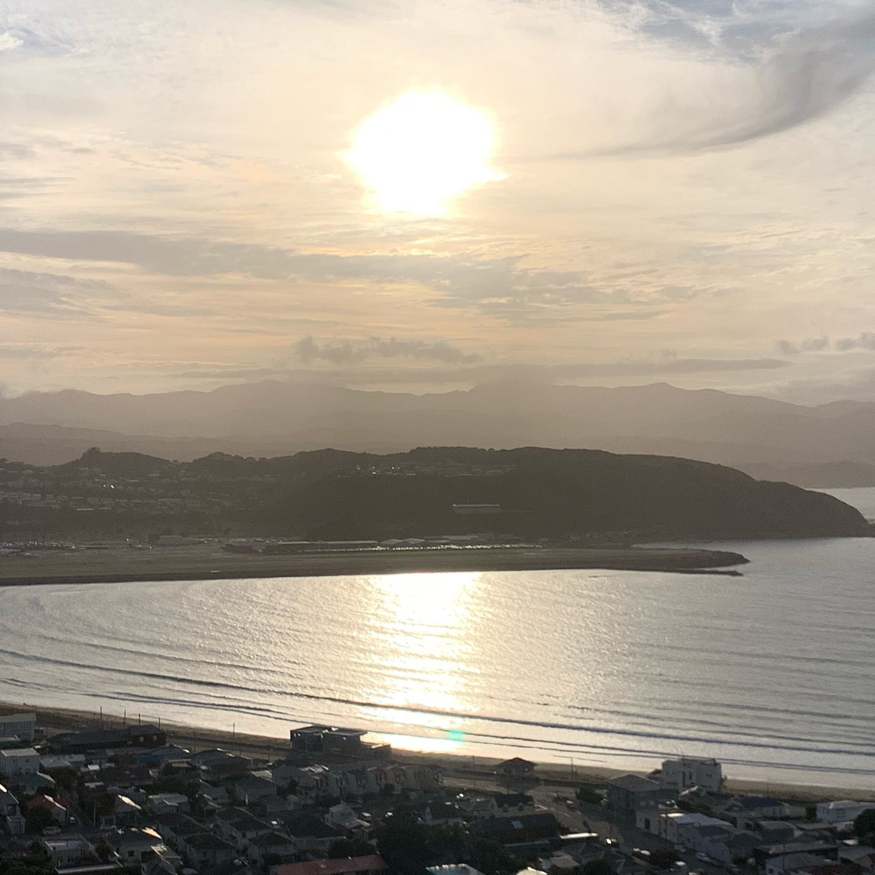 The sun rising over Lyall Bay in Wellington on christmas day 2019